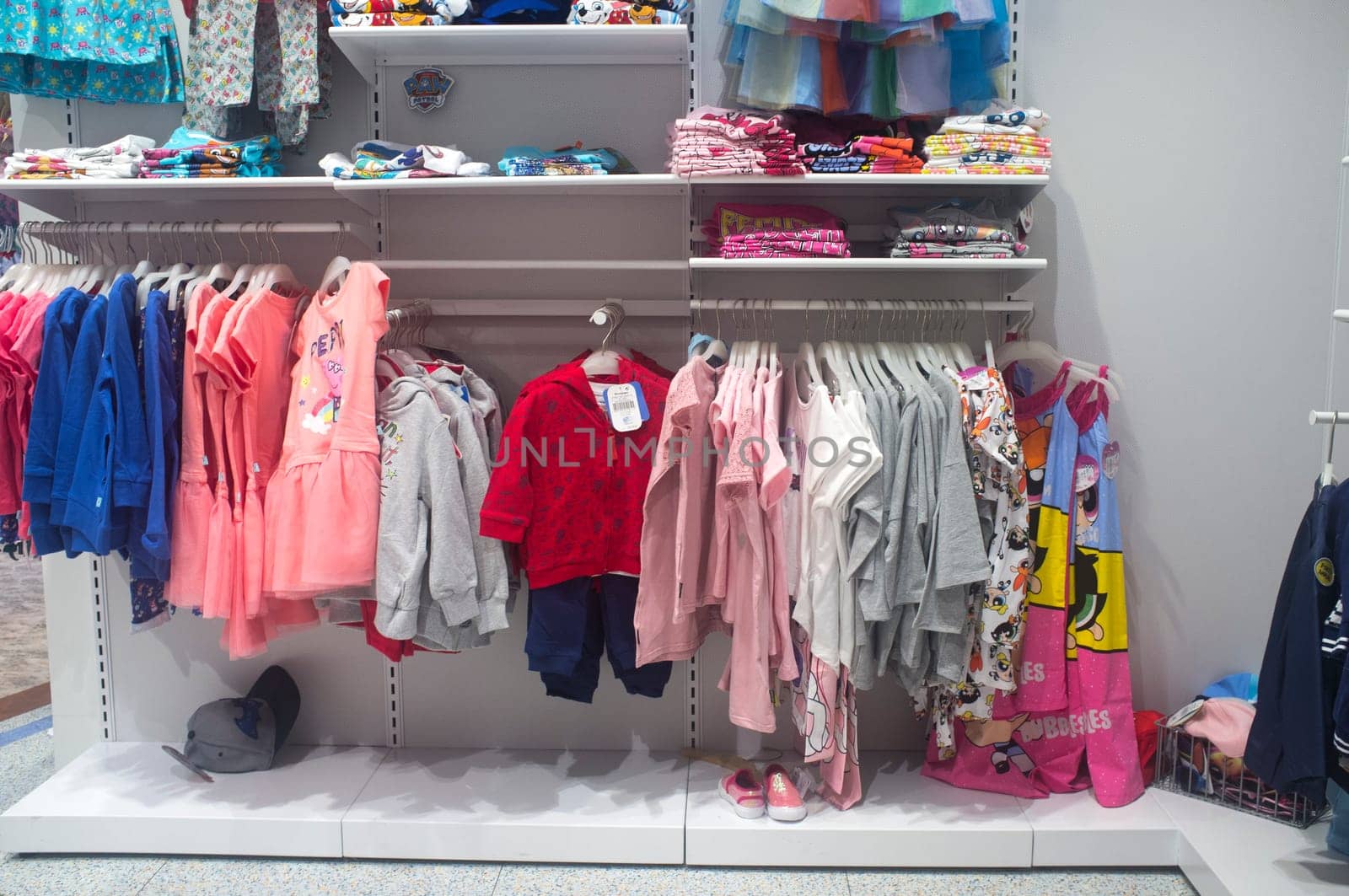 Spain, Badajoz - April 14th, 2018: Multicolored children clothing on the shelves of department store