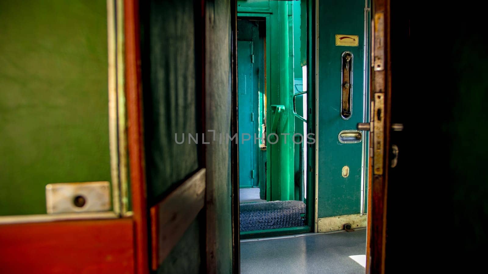 Old steam train car with long wooden corridor