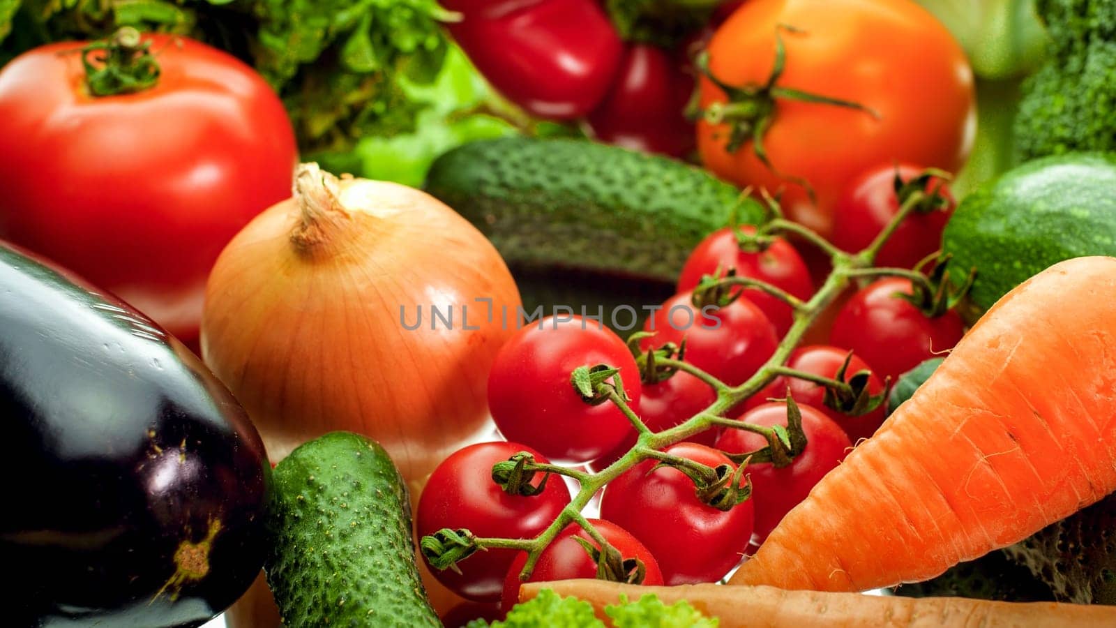 Closeup photo of onions, cucumber, carrot, bell pepper, eggplant and salad leaves