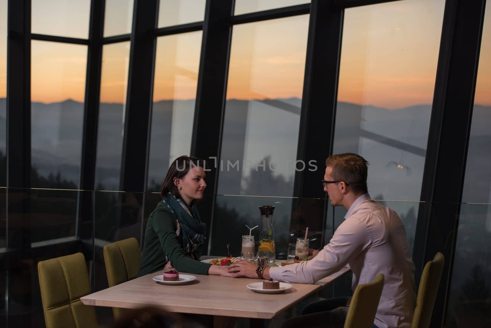Couple celebrate Valentine's day with romantic dinner in restaurant near the window