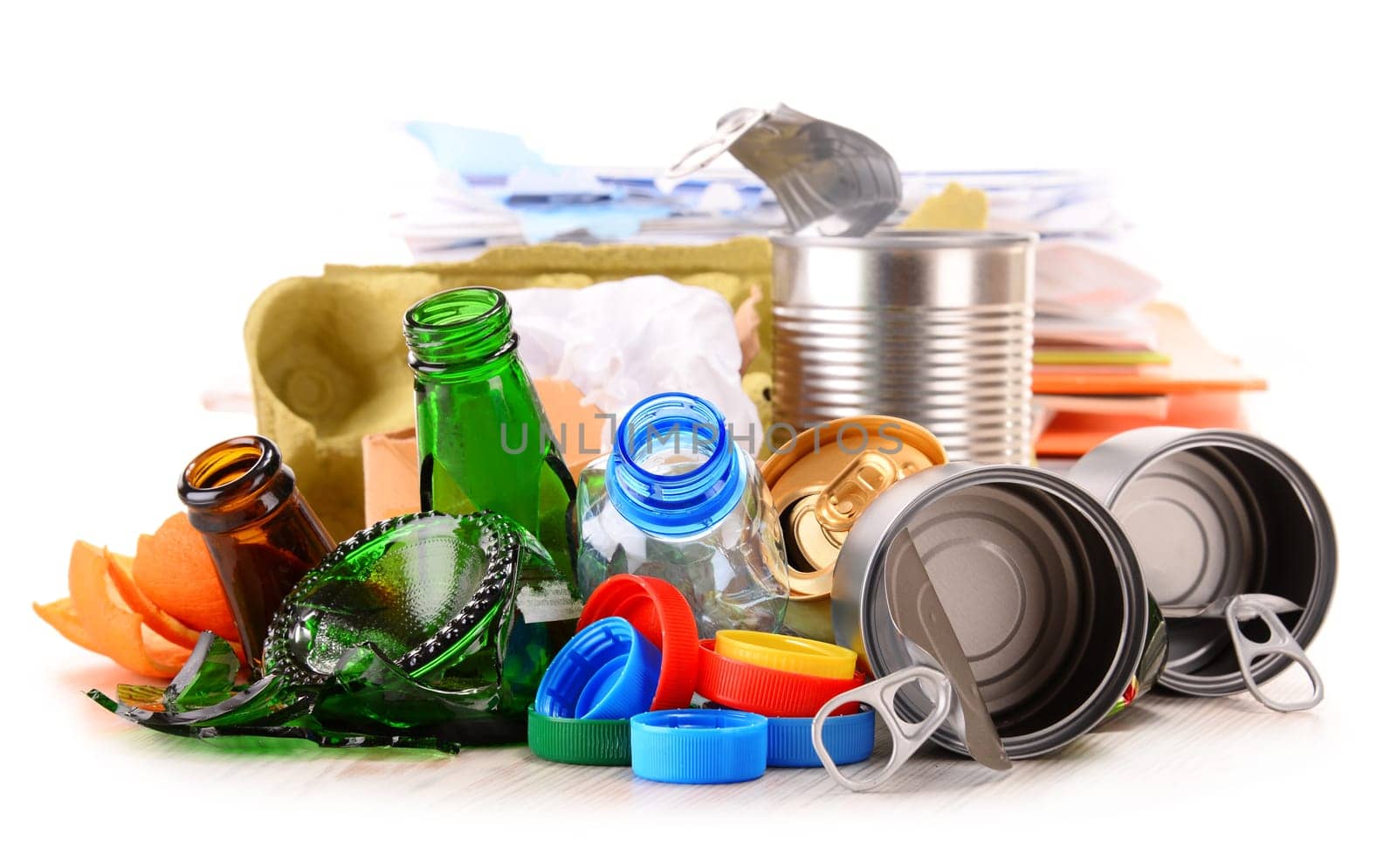 Recyclable garbage consisting of glass, plastic, metal and paper isolated on white background