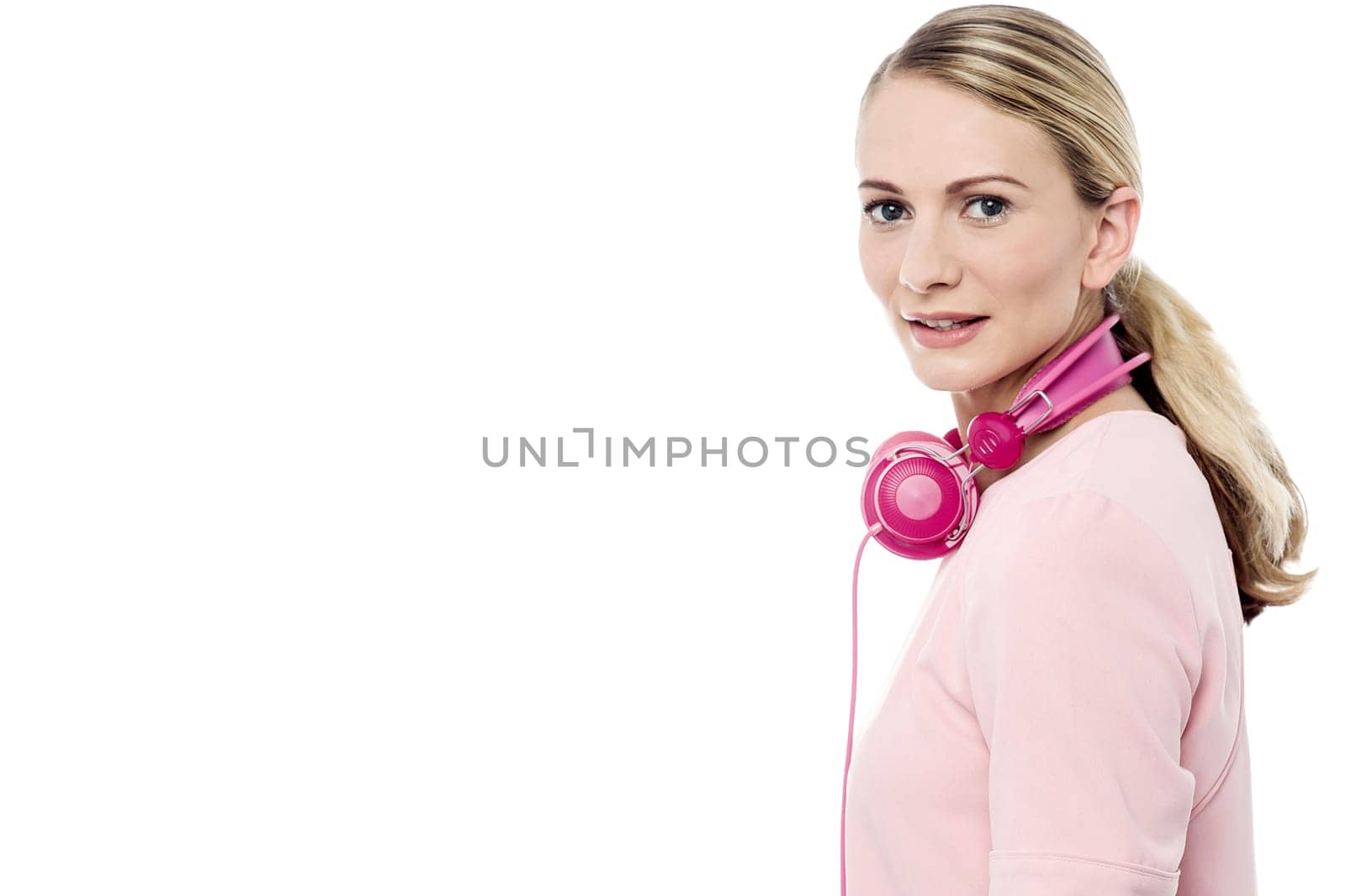Side pose of pretty woman with head phones