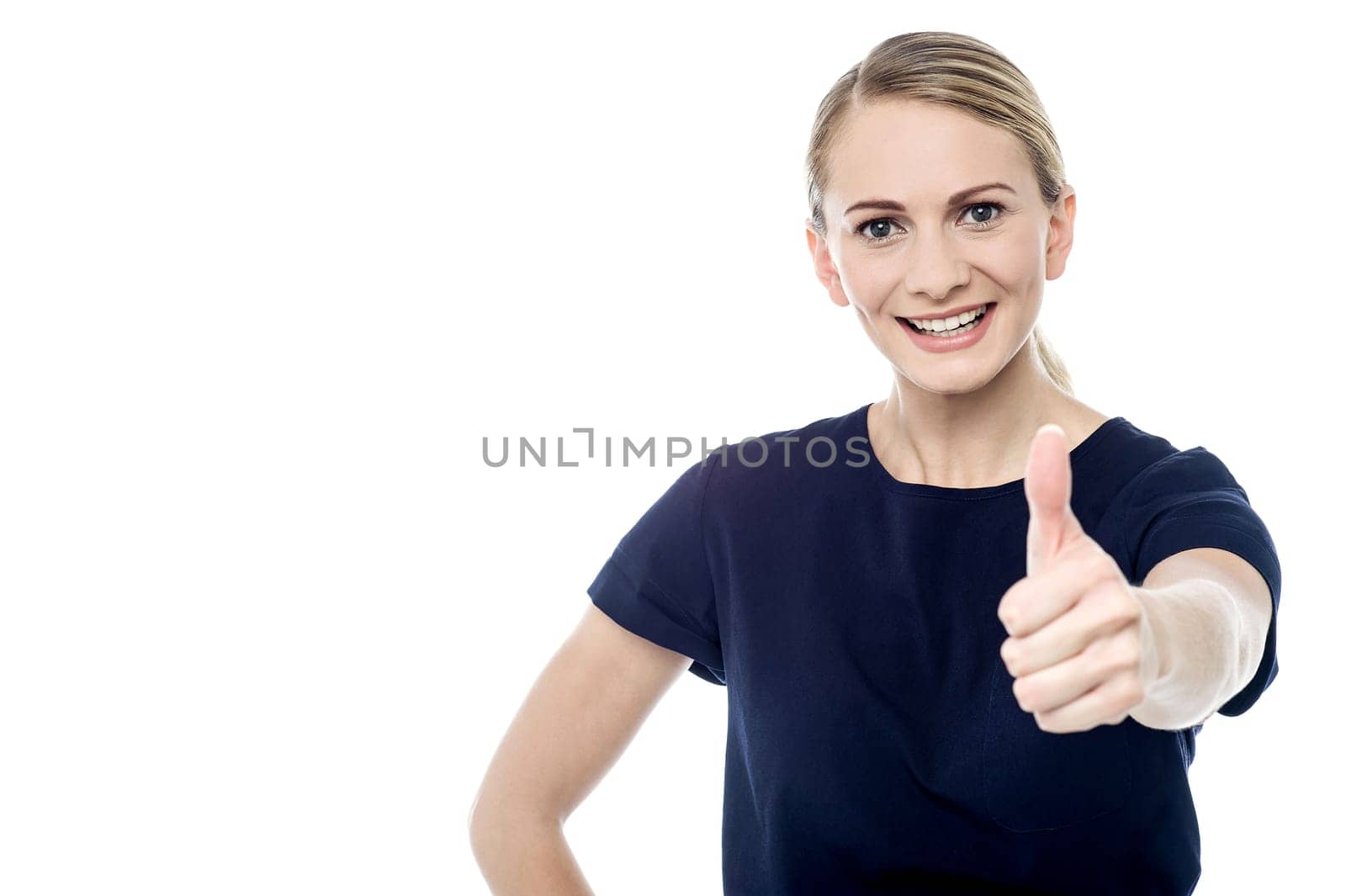 Smiling woman making thumb up gesture