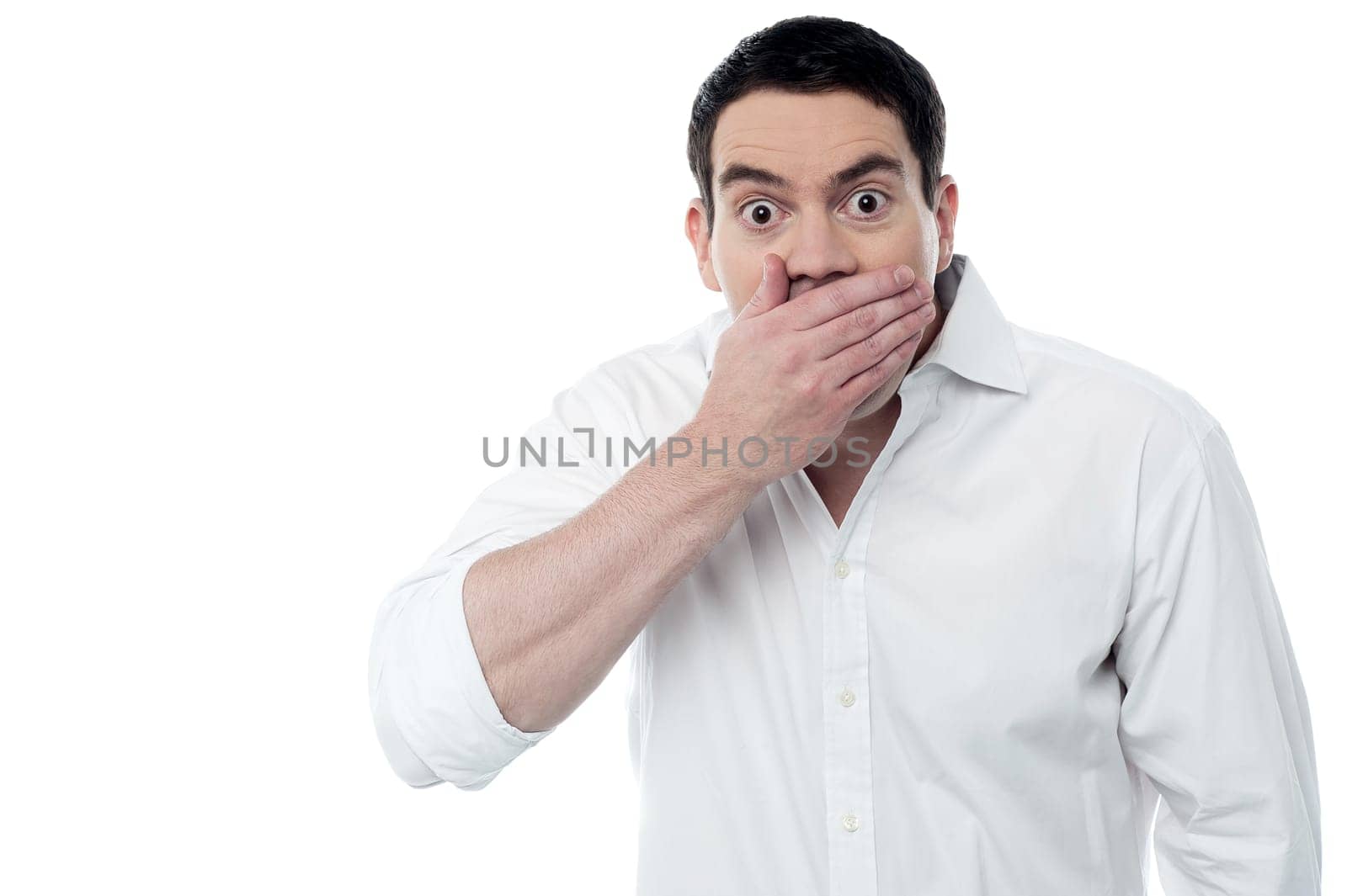 Surprised man covering his mouth with hand