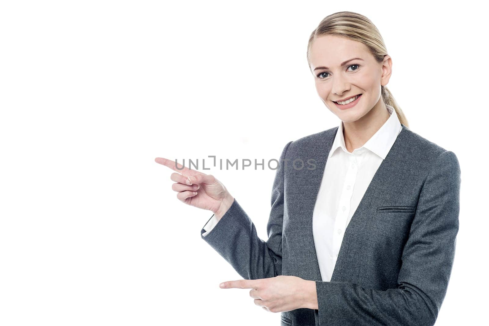 Female executive pointing something at copyspace