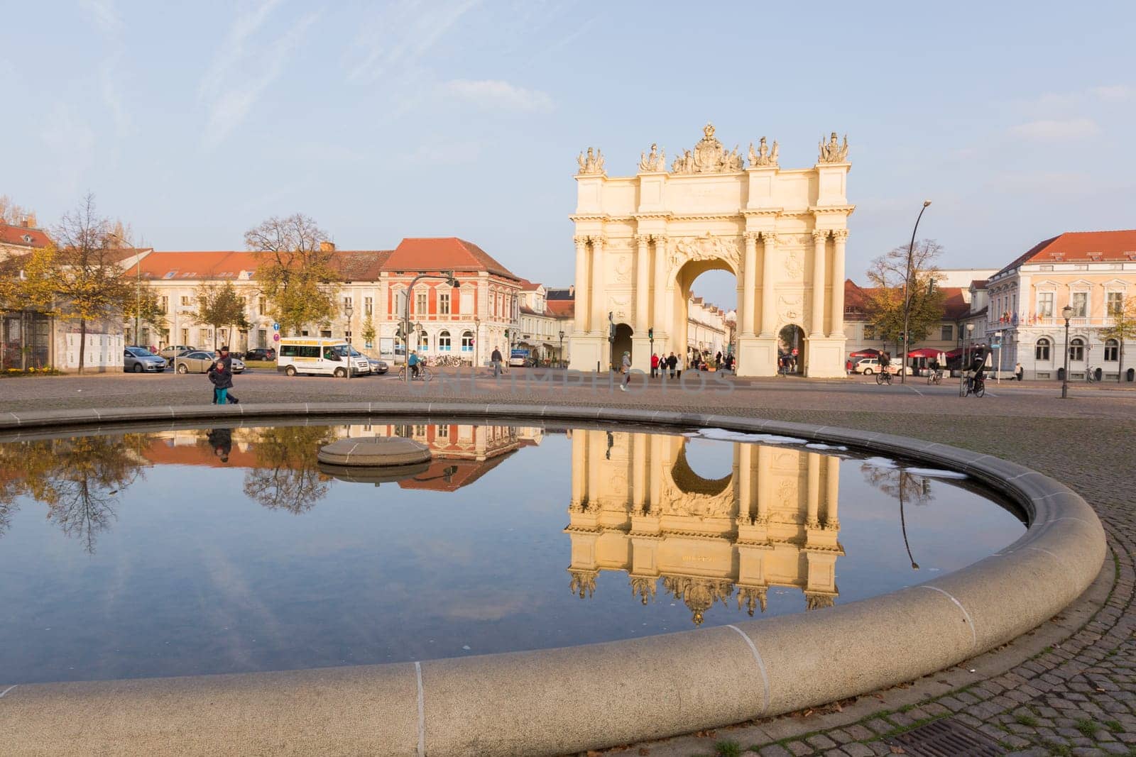 Brandenburg Gate in Potsdam is reflected in the fountain