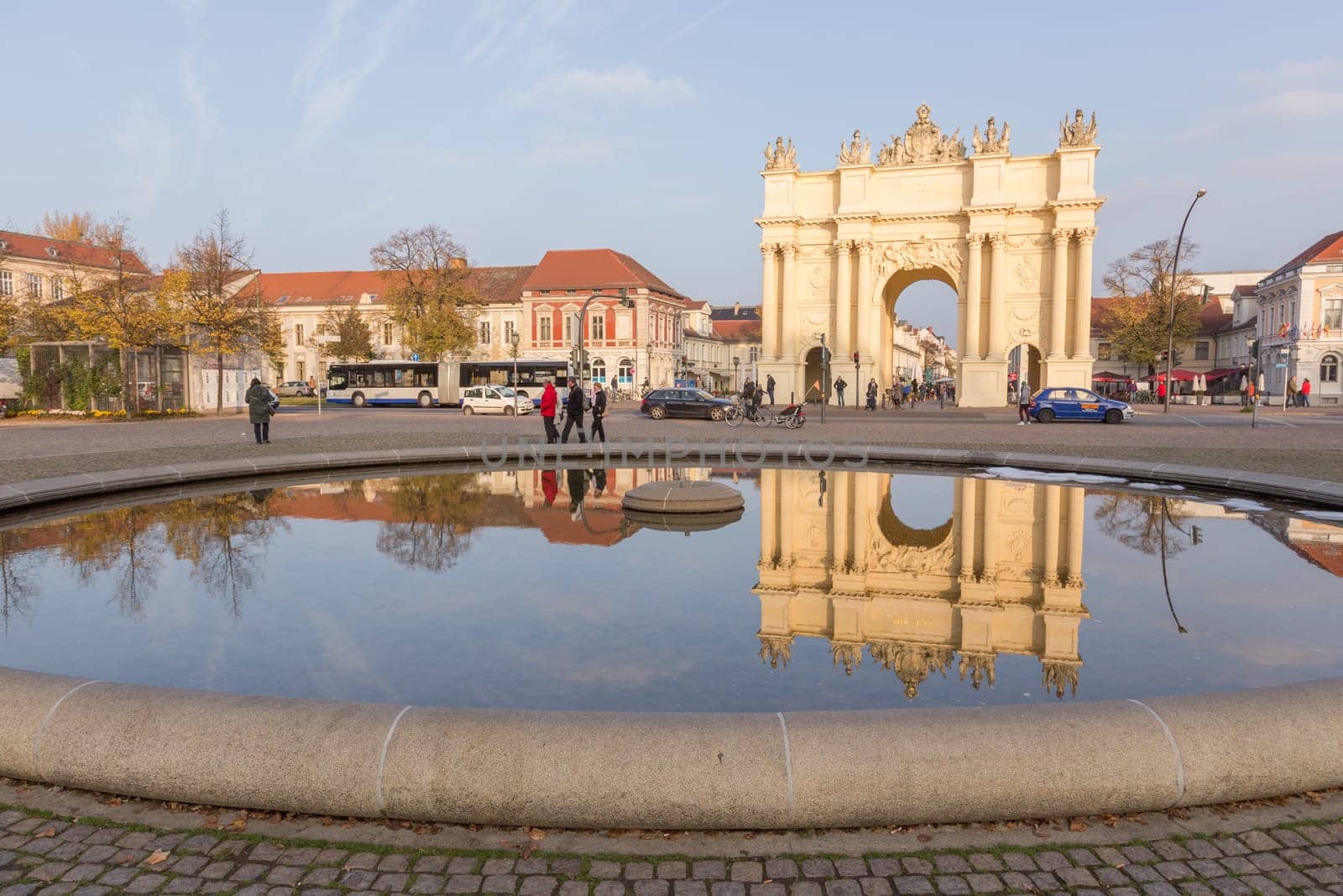 Brandenburg Gate in Potsdam is reflected in the fountain