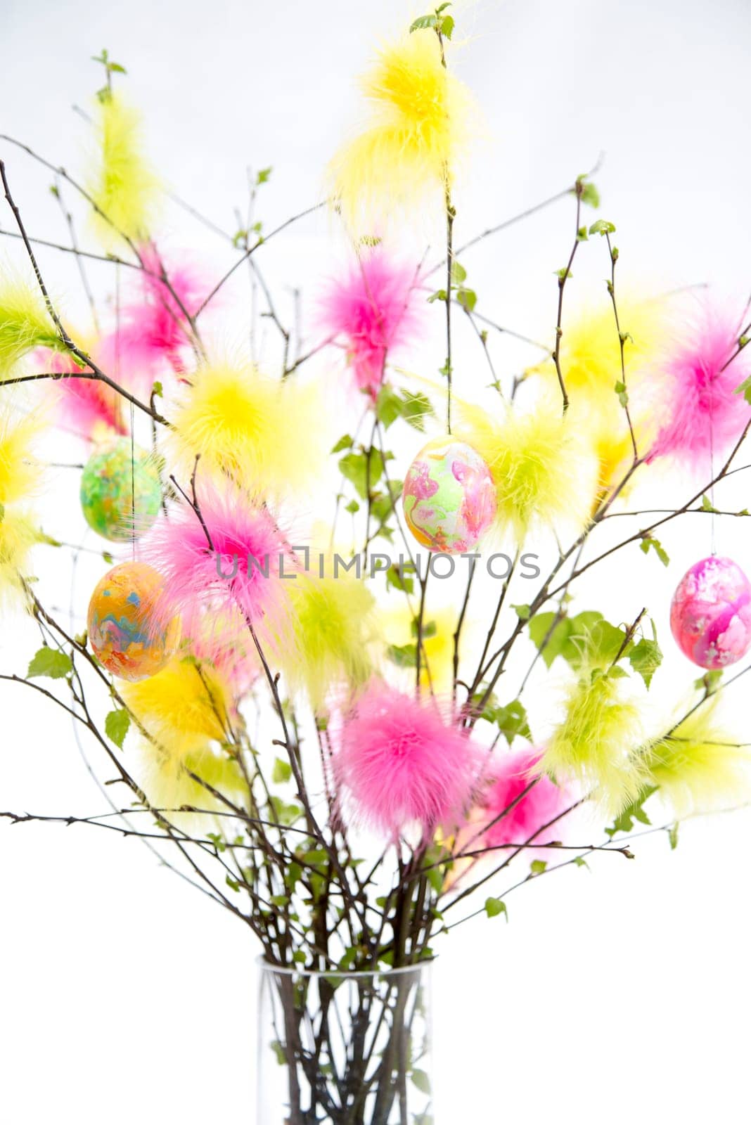 Easter Twigs with Coloured Feathers and Eggs and
