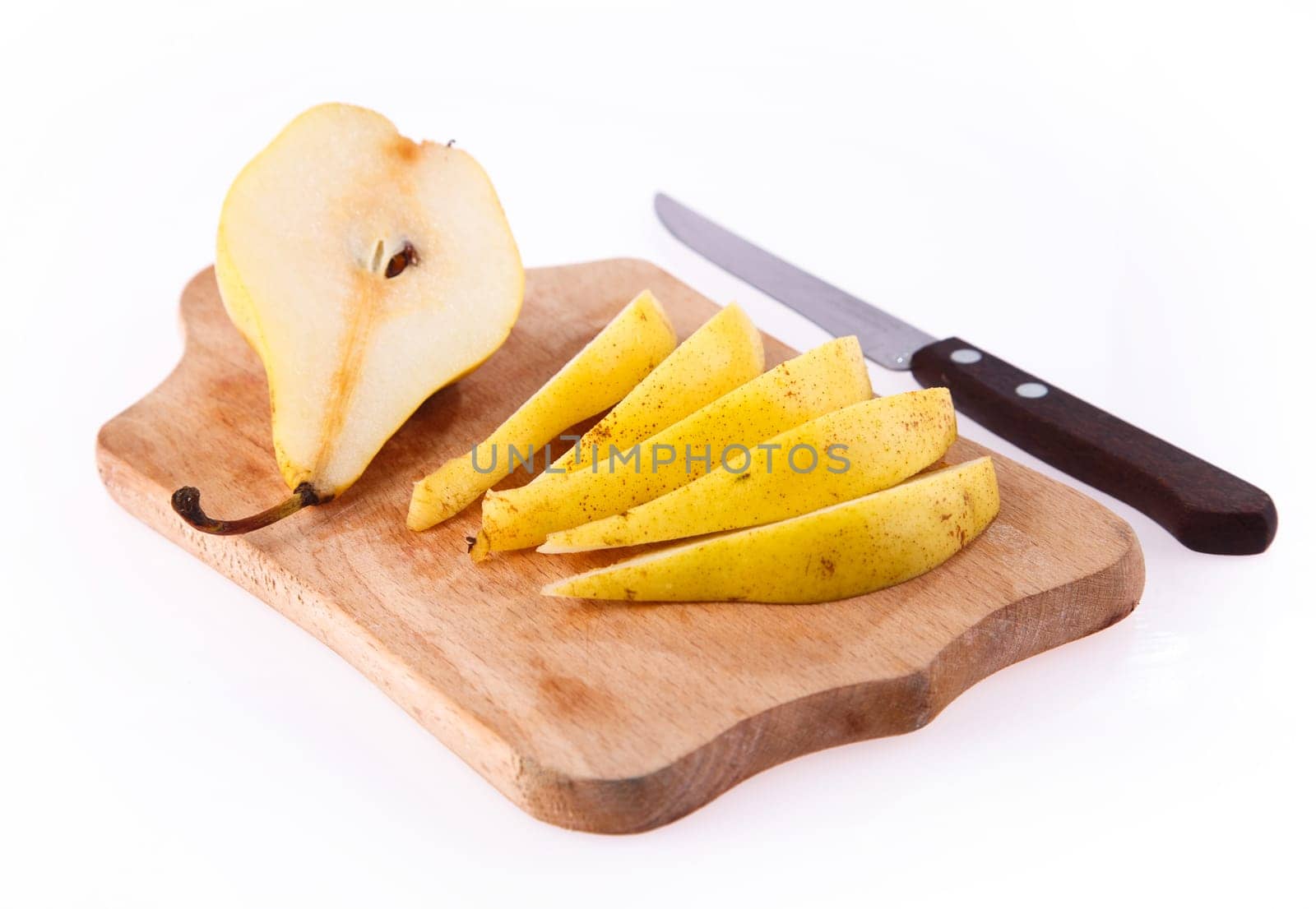 Sliced â â pear on the board on a white background