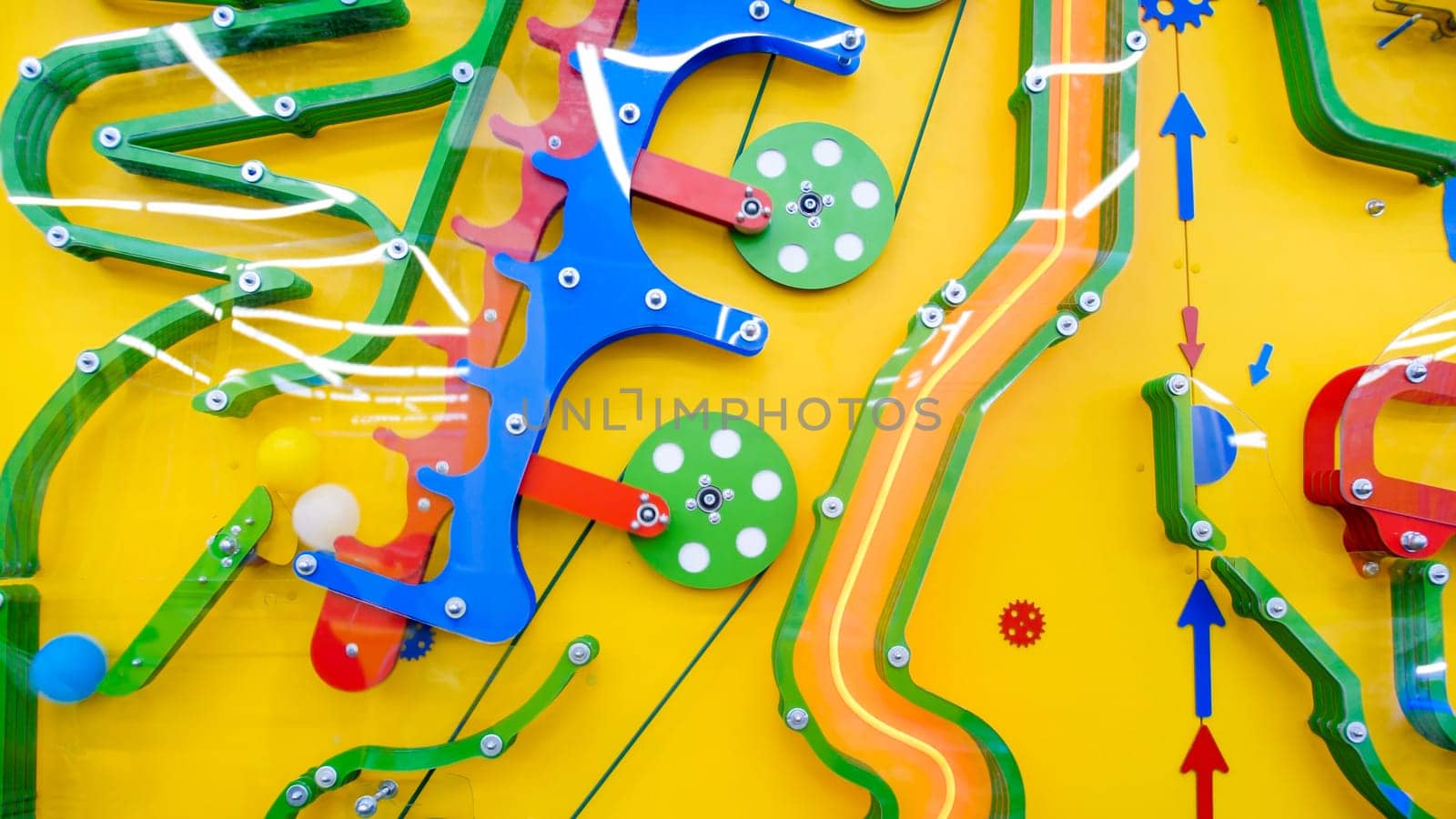 Abstract image of colorful mechanism for children education on playground.