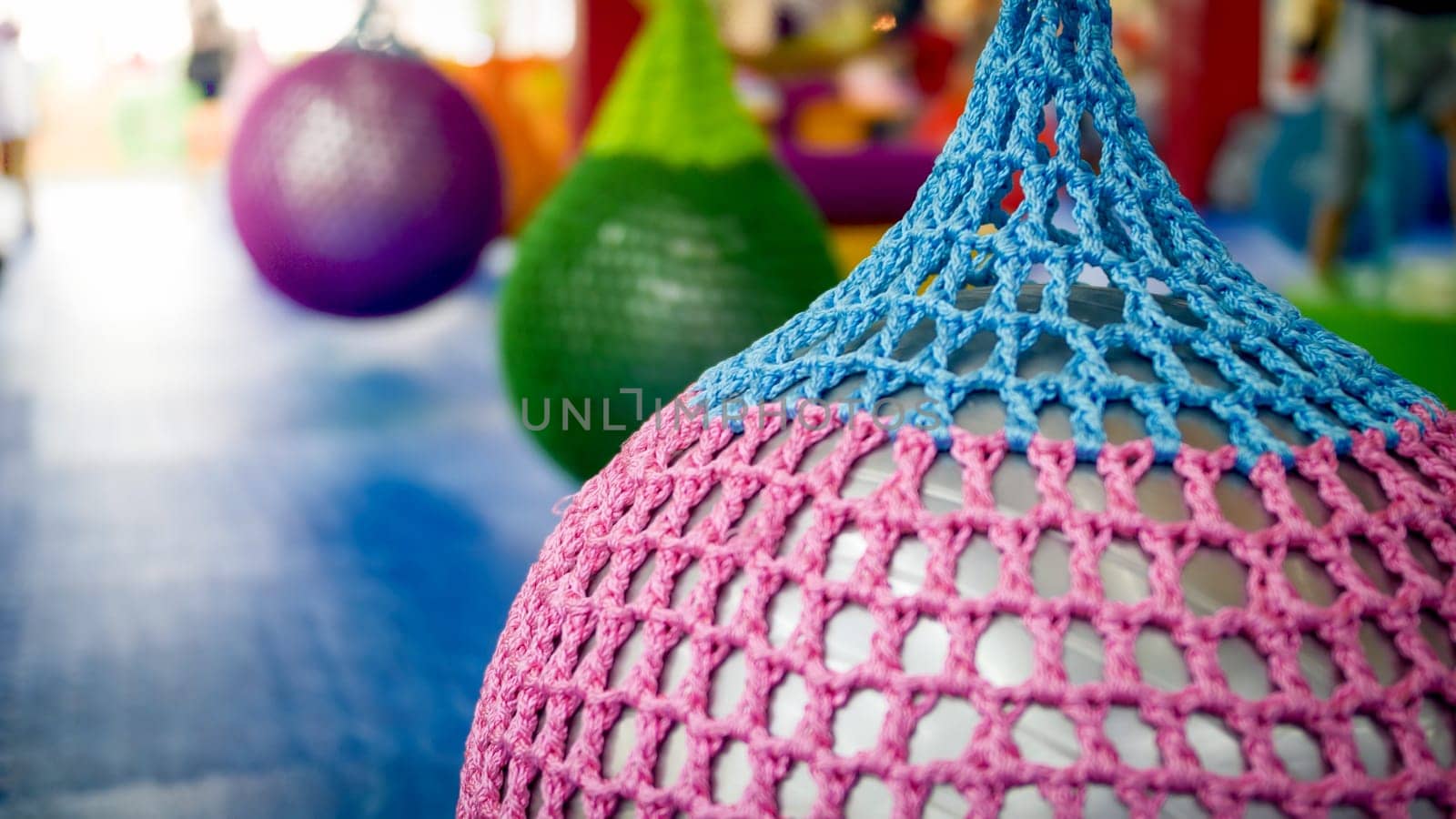 Closeup image of colorful fitness ball in yoga studio or gym.