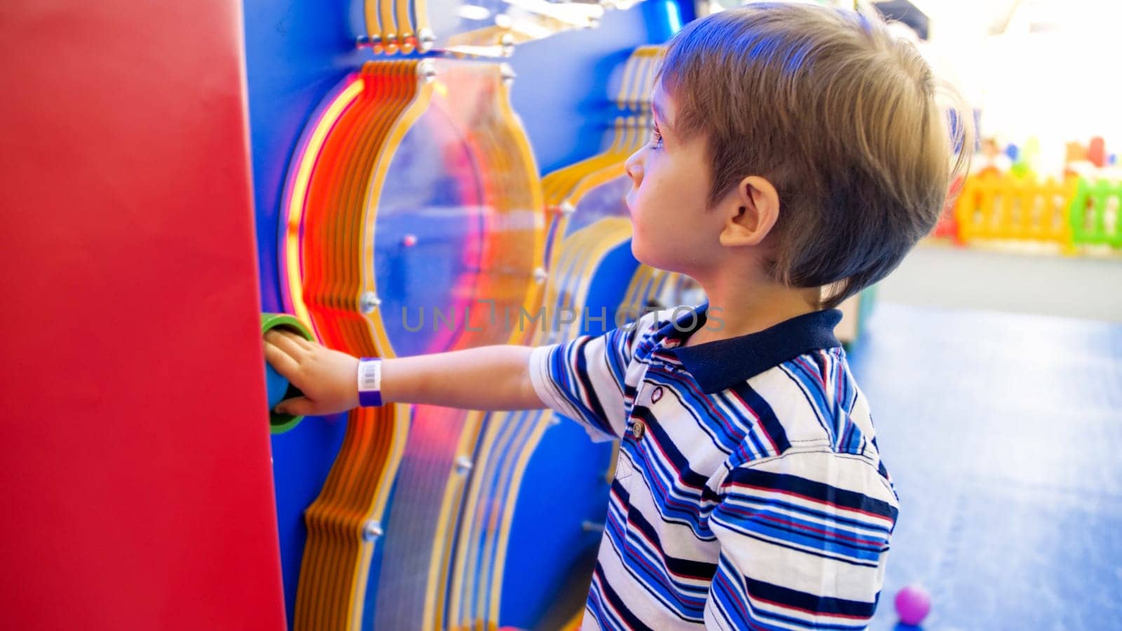 Portrait of cute little boy in educational board at museum of science.