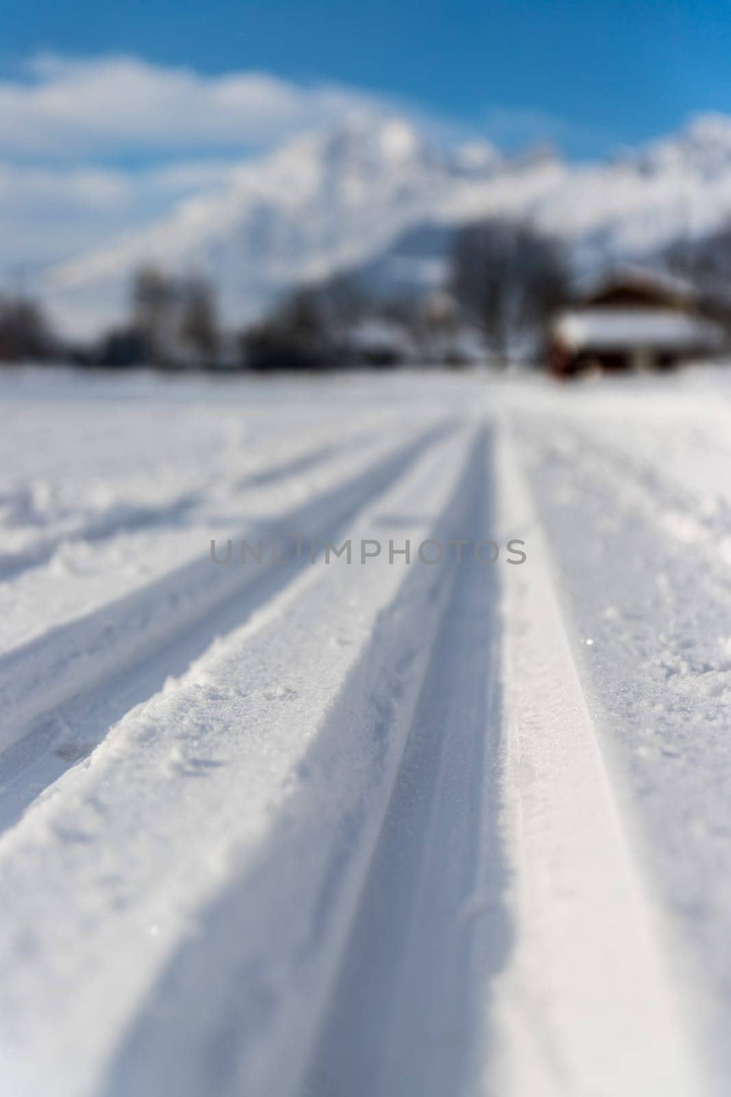 Cross-country skiing slope in Austria, beautiful mountain scenery, blurry background