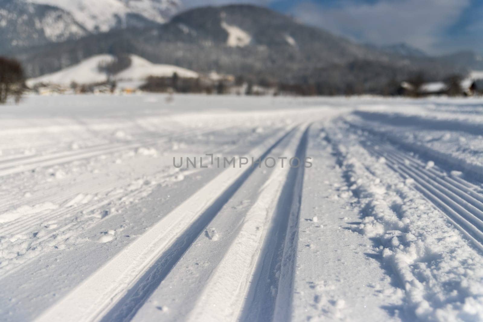Cross-country skiing slope in Austria, beautiful mountain scenery, blurry background