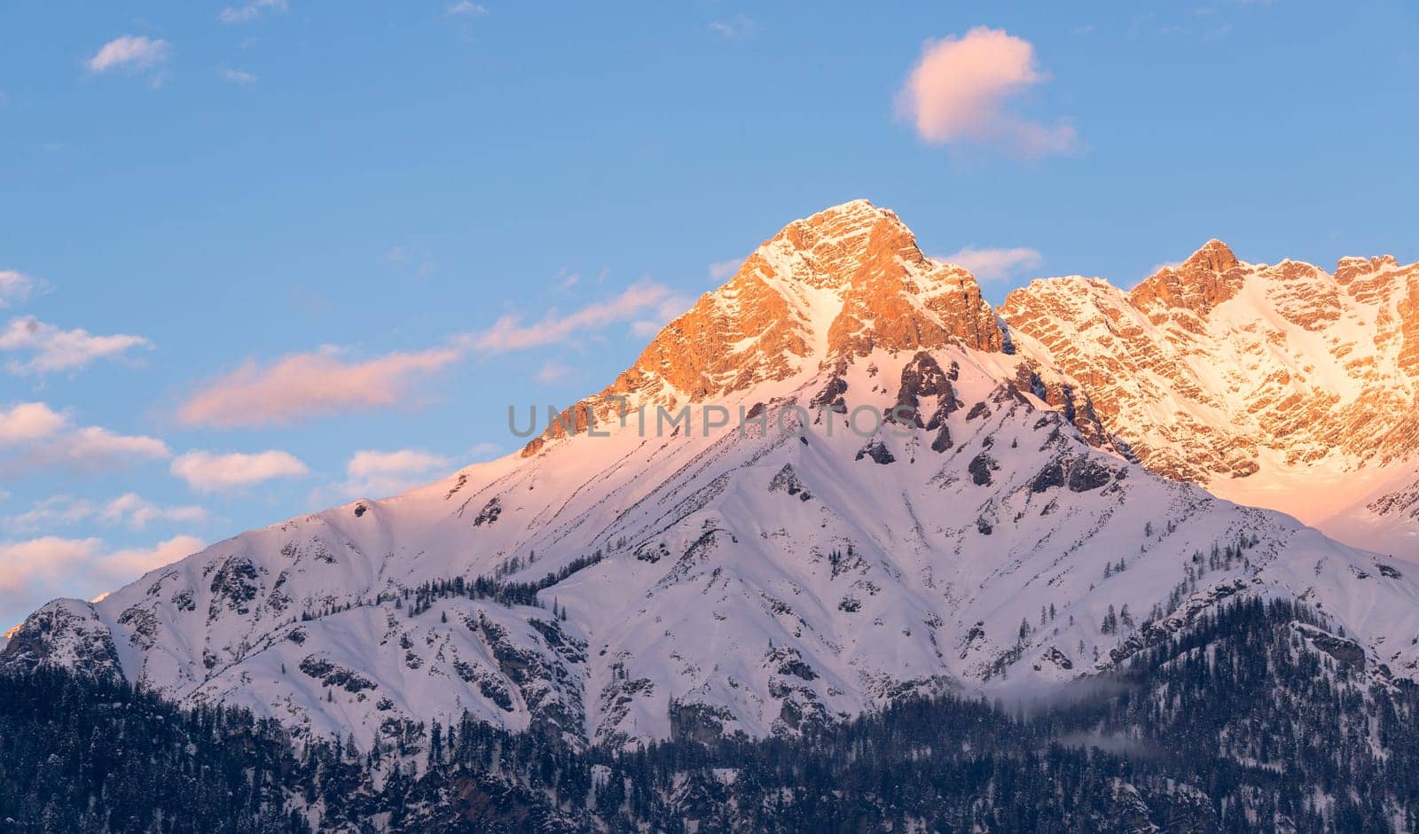 Idyllic scenery with snowy mountains in the evening sun, Alps, Austria