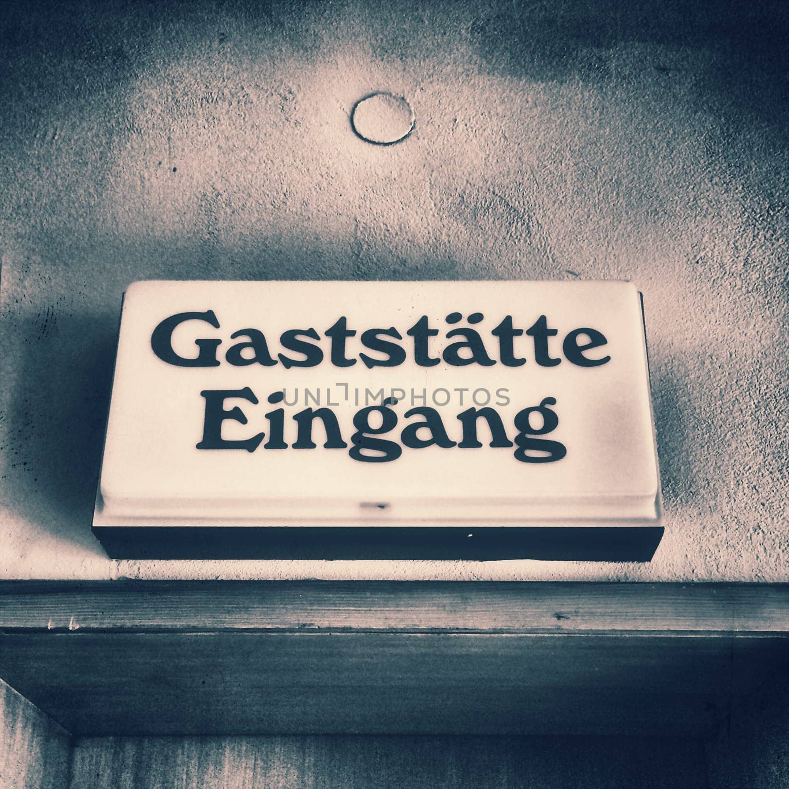 old German door sign of a restaurant of the 60s