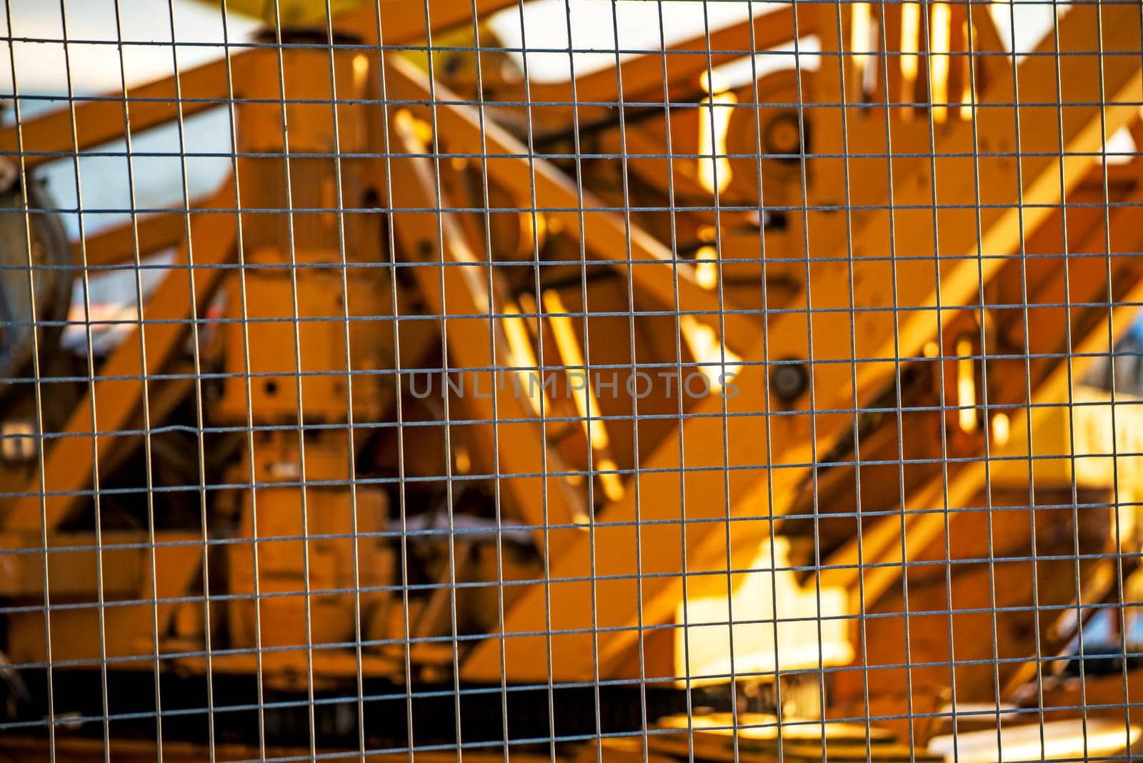 caterpillar behind fence