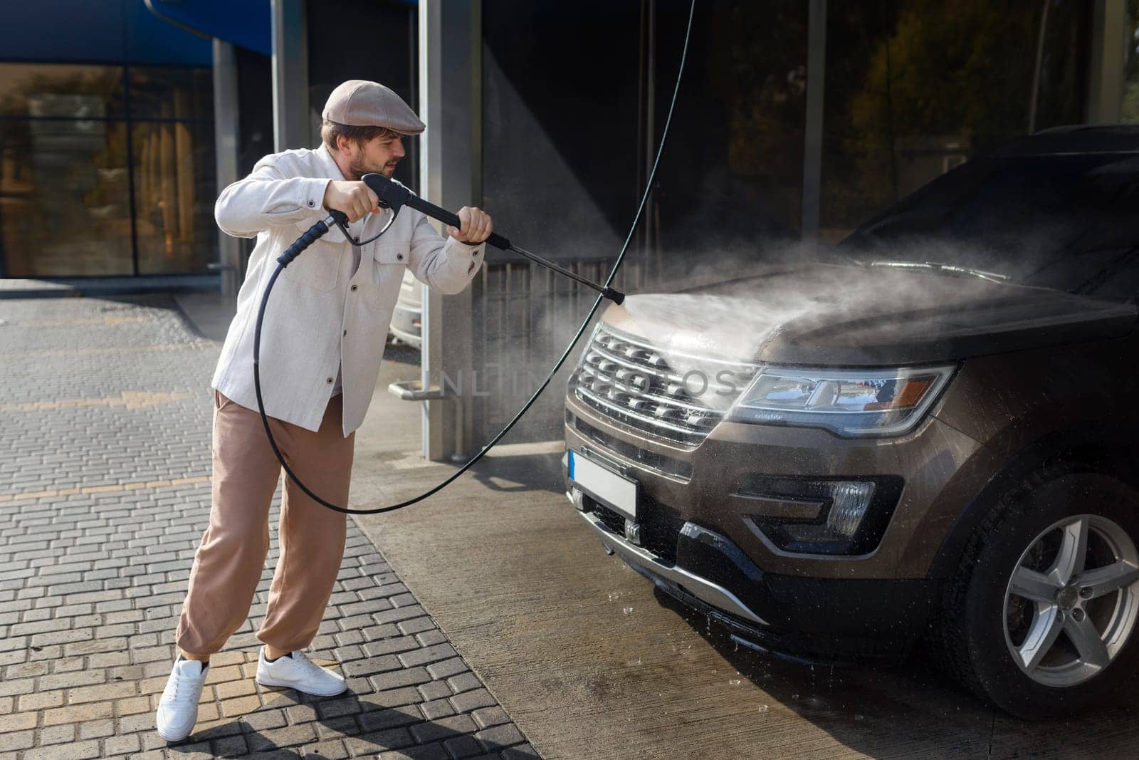 He loves his car. Man washing car. High quality photo