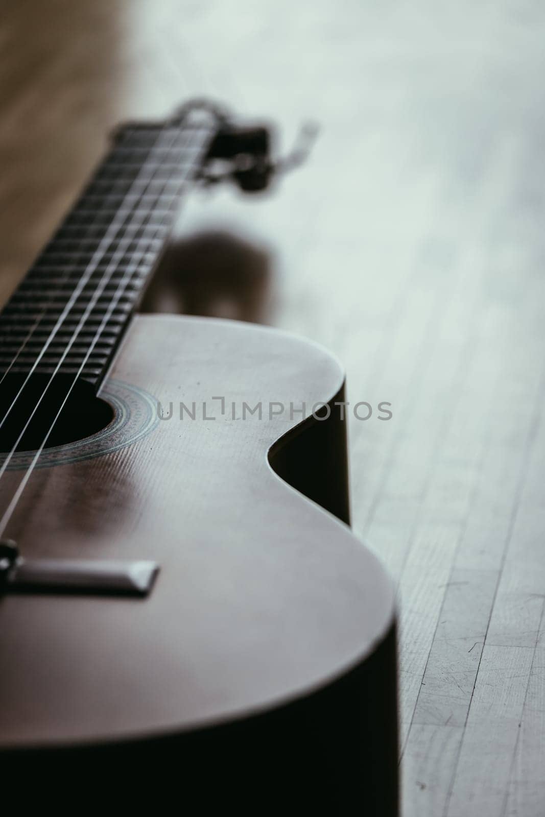 Cutout of a classical guitar corpus and strings, closeup