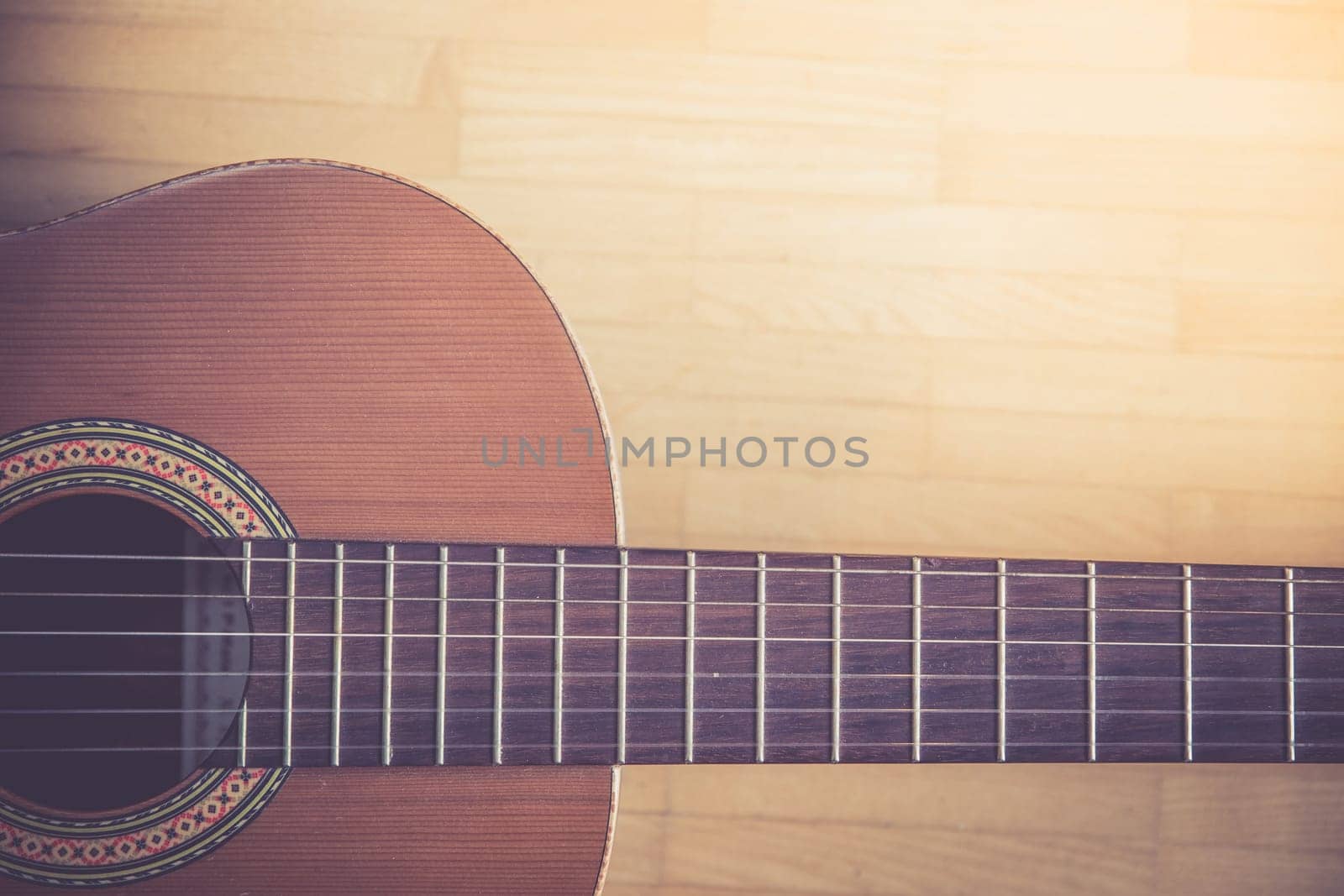 Cutout of a classical guitar corpus and strings, closeup