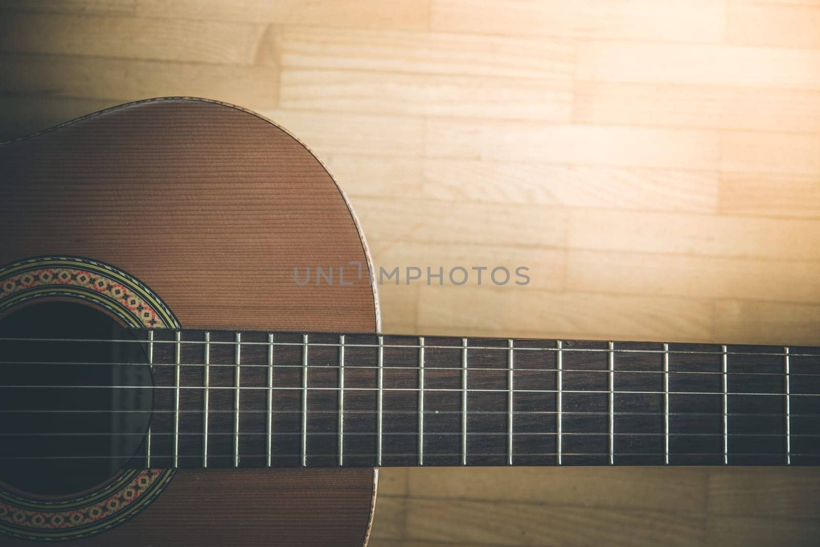 Cutout of a classical guitar corpus and strings, closeup