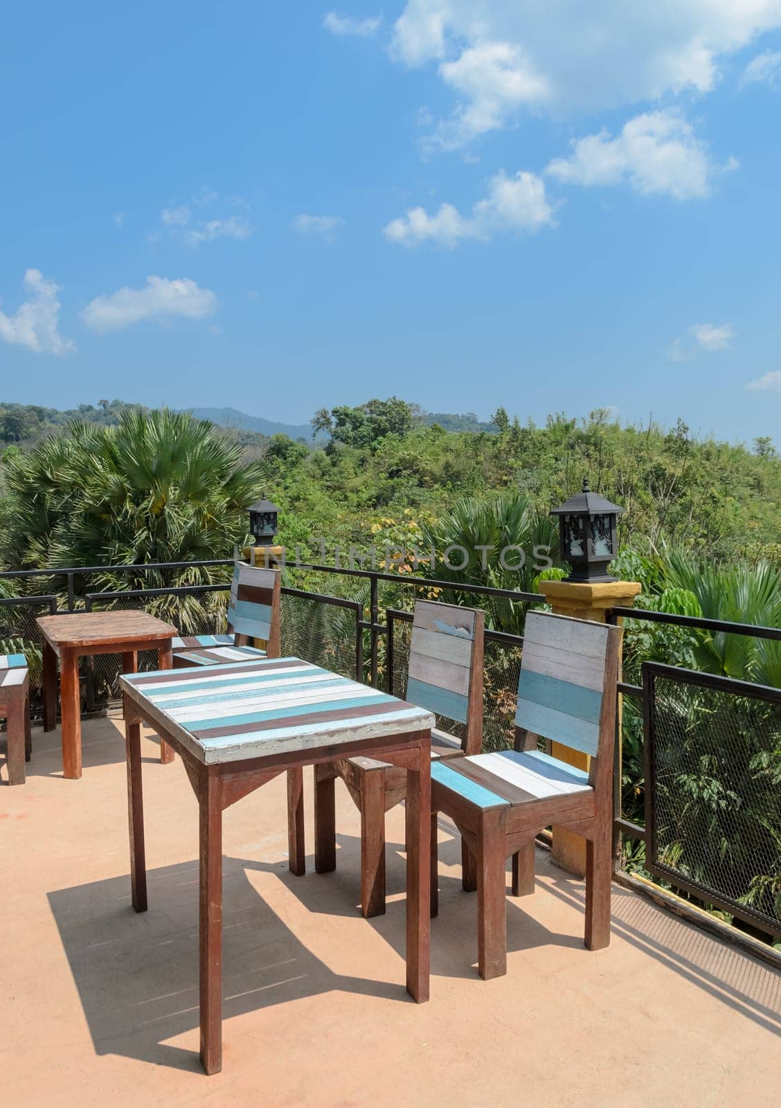 Outdoor deck and patio furniture with mountain view. Southern Thailand