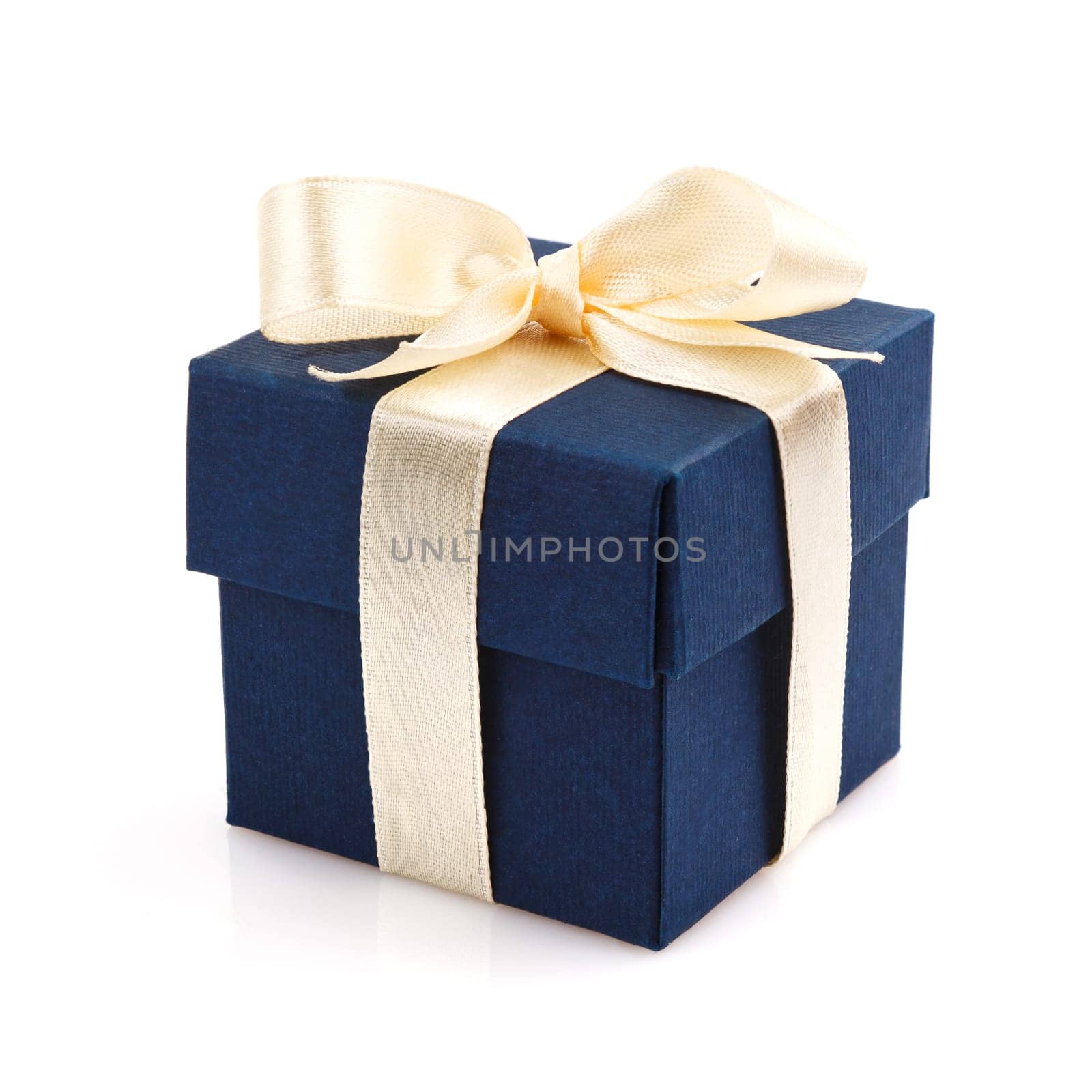 dark blue gift box with golden ribbon and bow isolated on white