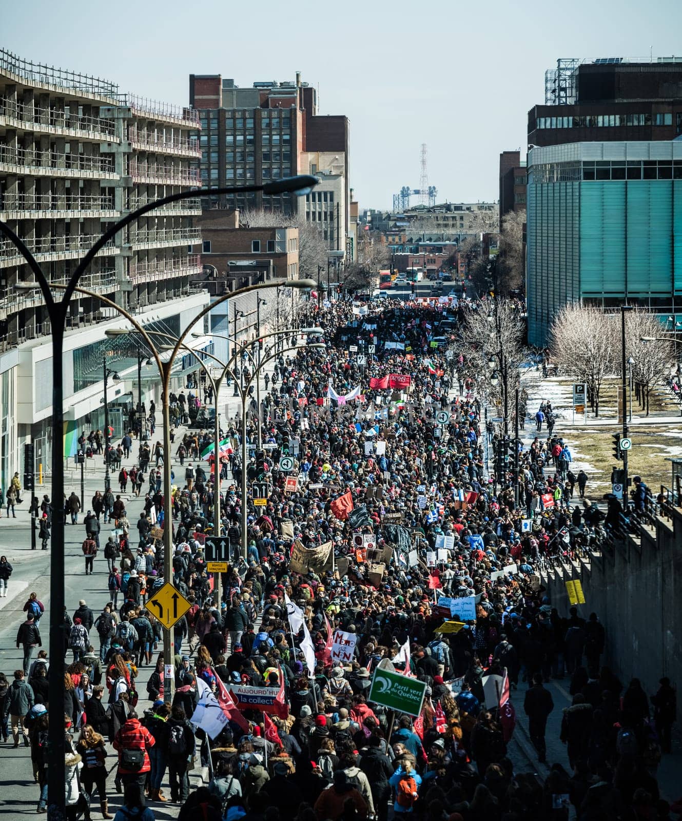 MONTREAL, CANADA, APRIL 02 2015. Riot in the Montreal Streets to counter the Economic Austerity Measures. Panoramic View (XXXL Resolution) of the Streets Packed with Protesters