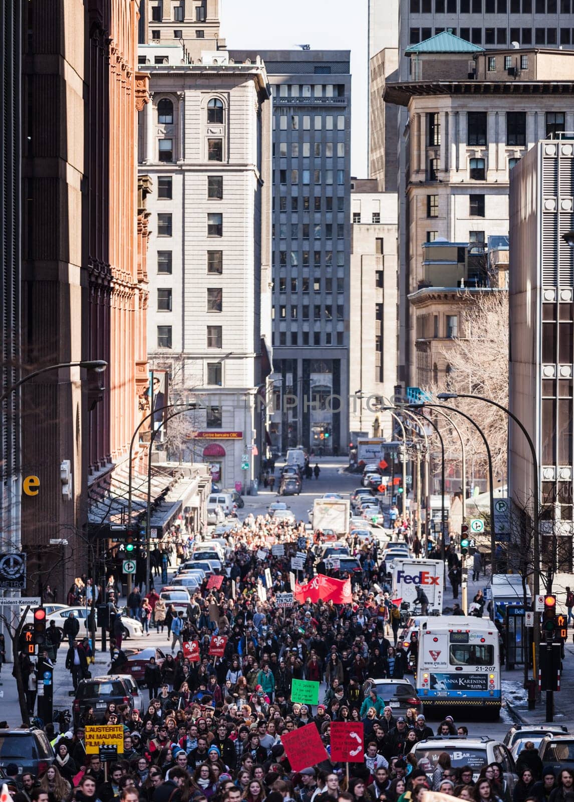MONTREAL, CANADA, APRIL 02 2015. Riot in the Montreal Streets to counter the Economic Austerity Measures. People walking in the middle of the street.