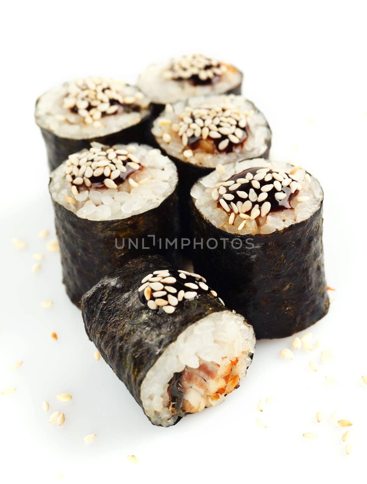 Traditional japanese sushi sprinkled with sesame seeds isolated on white background