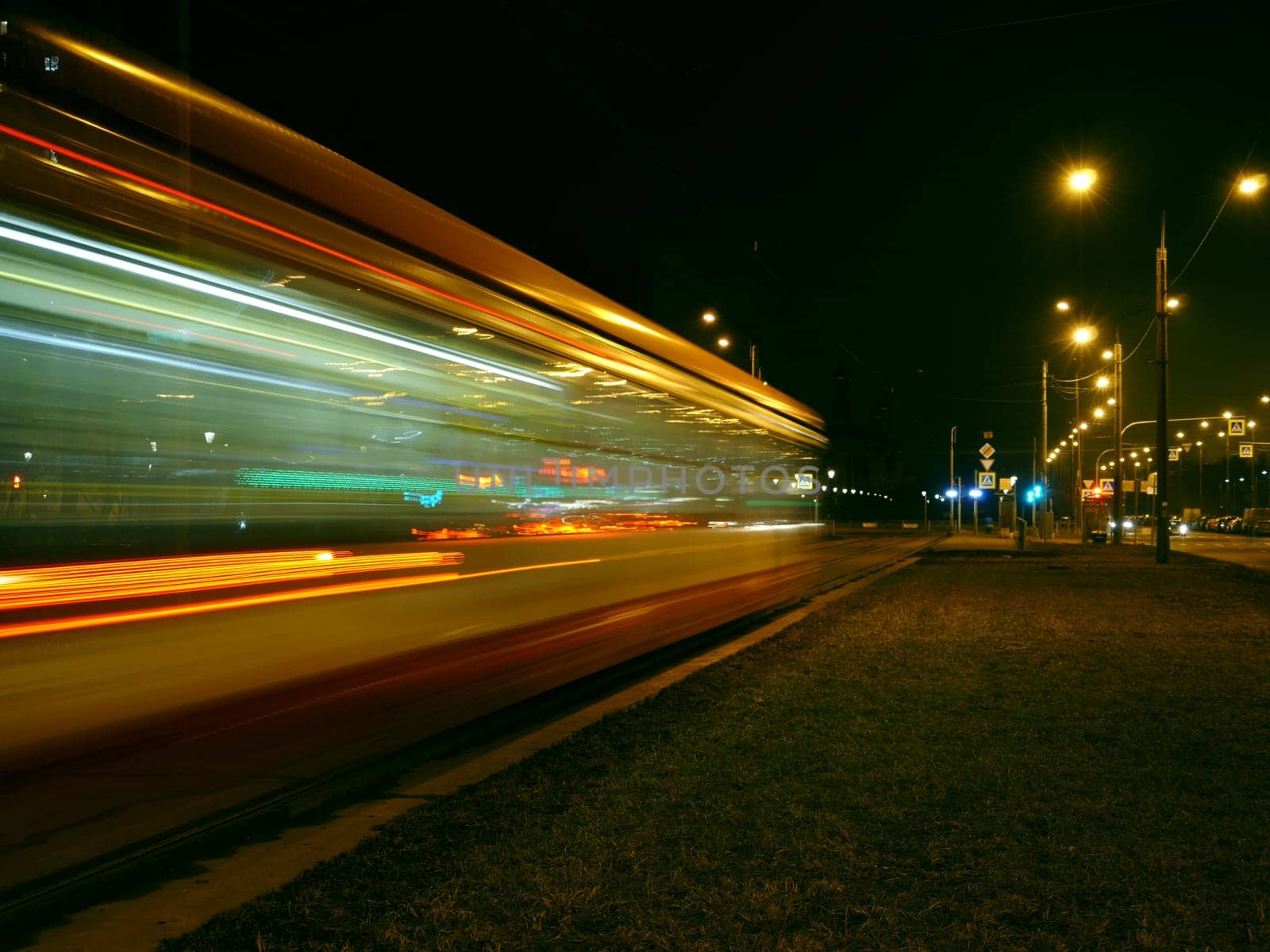 night tram red light trails motion blur passing by
