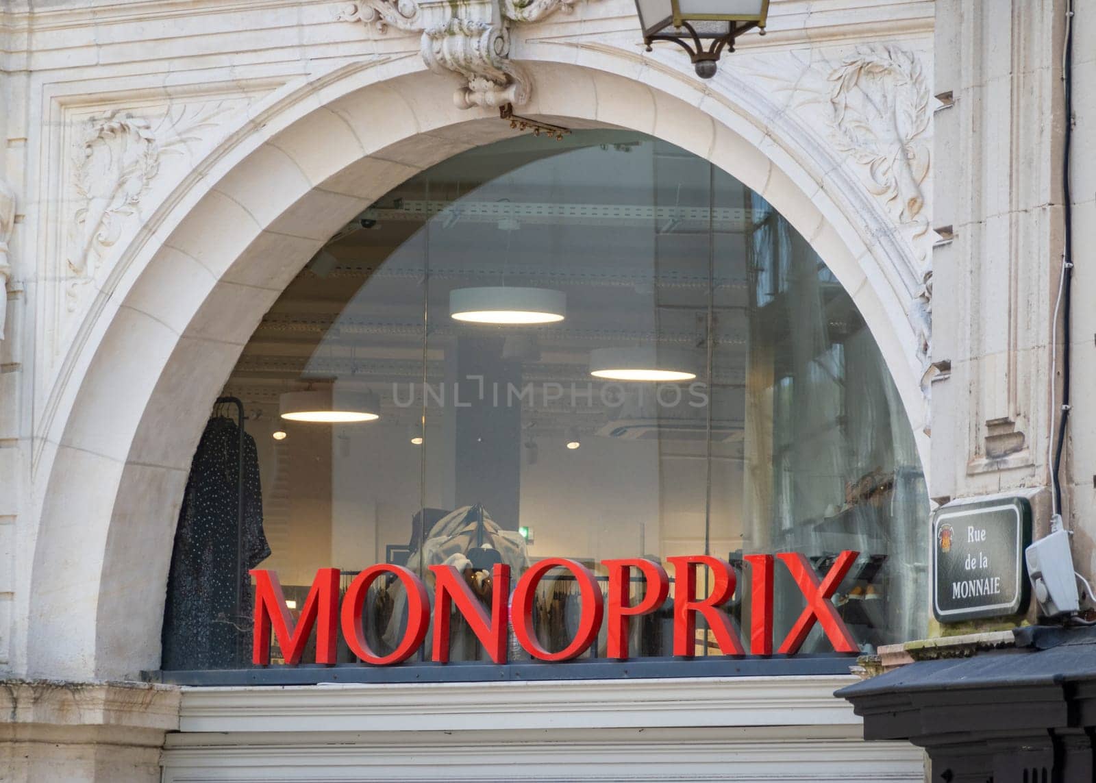BAYONNE, FRANCE - CIRCA APRIL 2021: Red Monoprix sign outside supermarket.