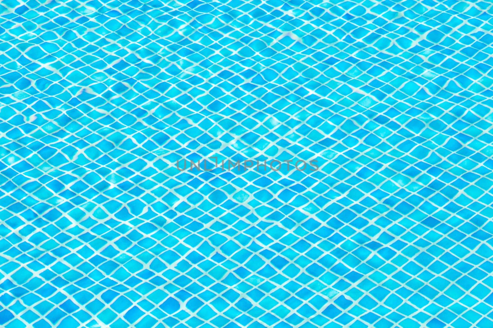 Blue swimming pool background, ripple effect from the water