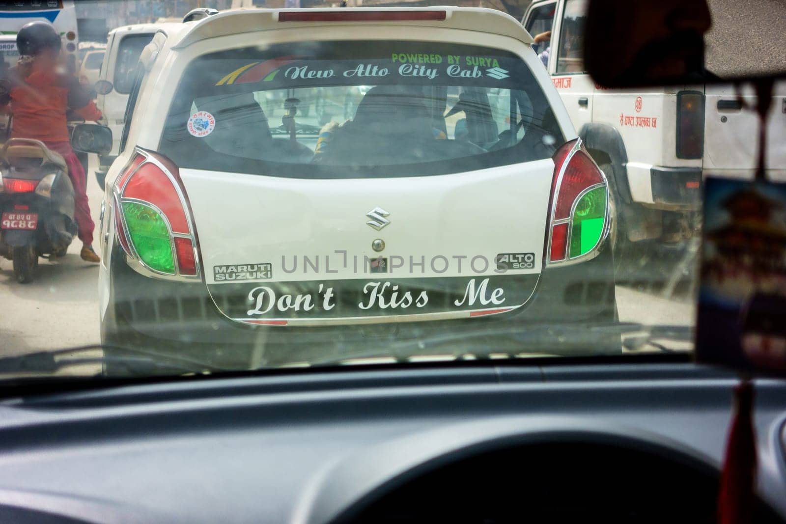 KATHMANDU, NEPAL - CIRCA FEBRUARY 2018: Don't kiss me sticker on the back of a taxi.