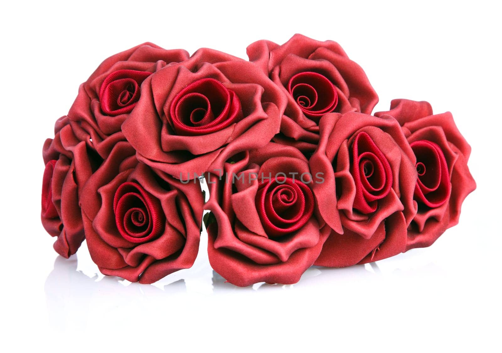 artificial bouquet of red roses on a white background