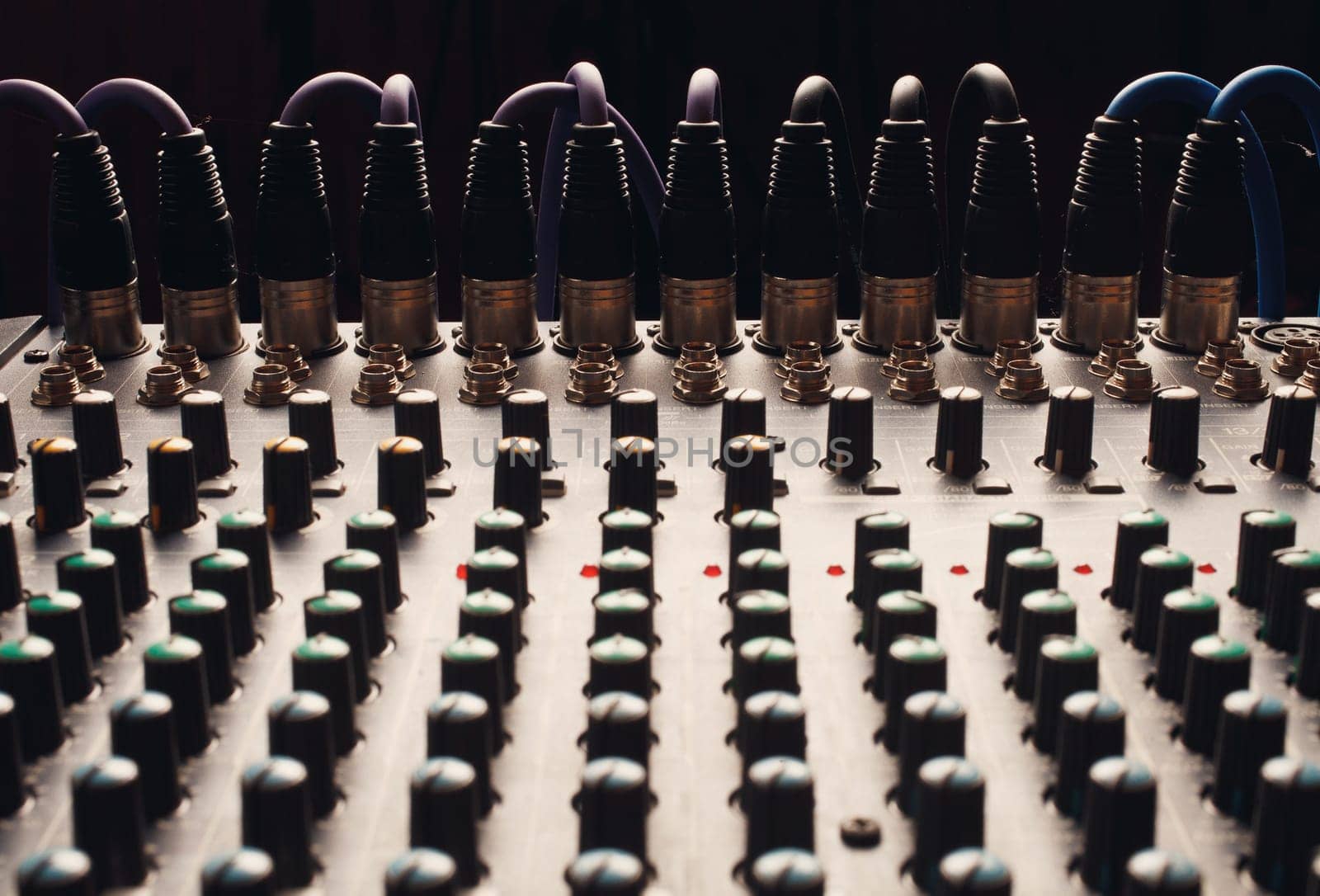 Knobs of a studio soundboard with cord jack