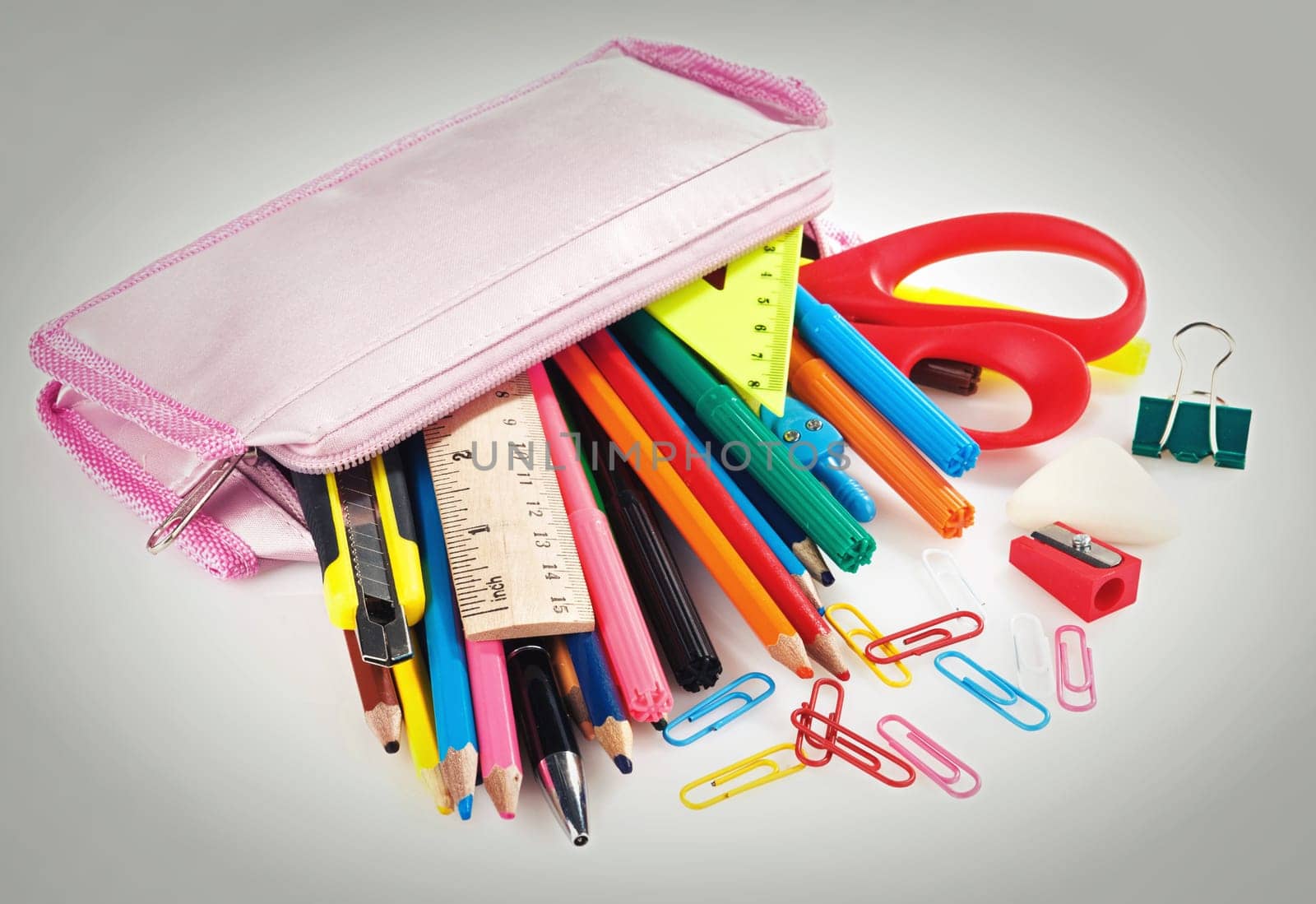pencil box full of school supplies