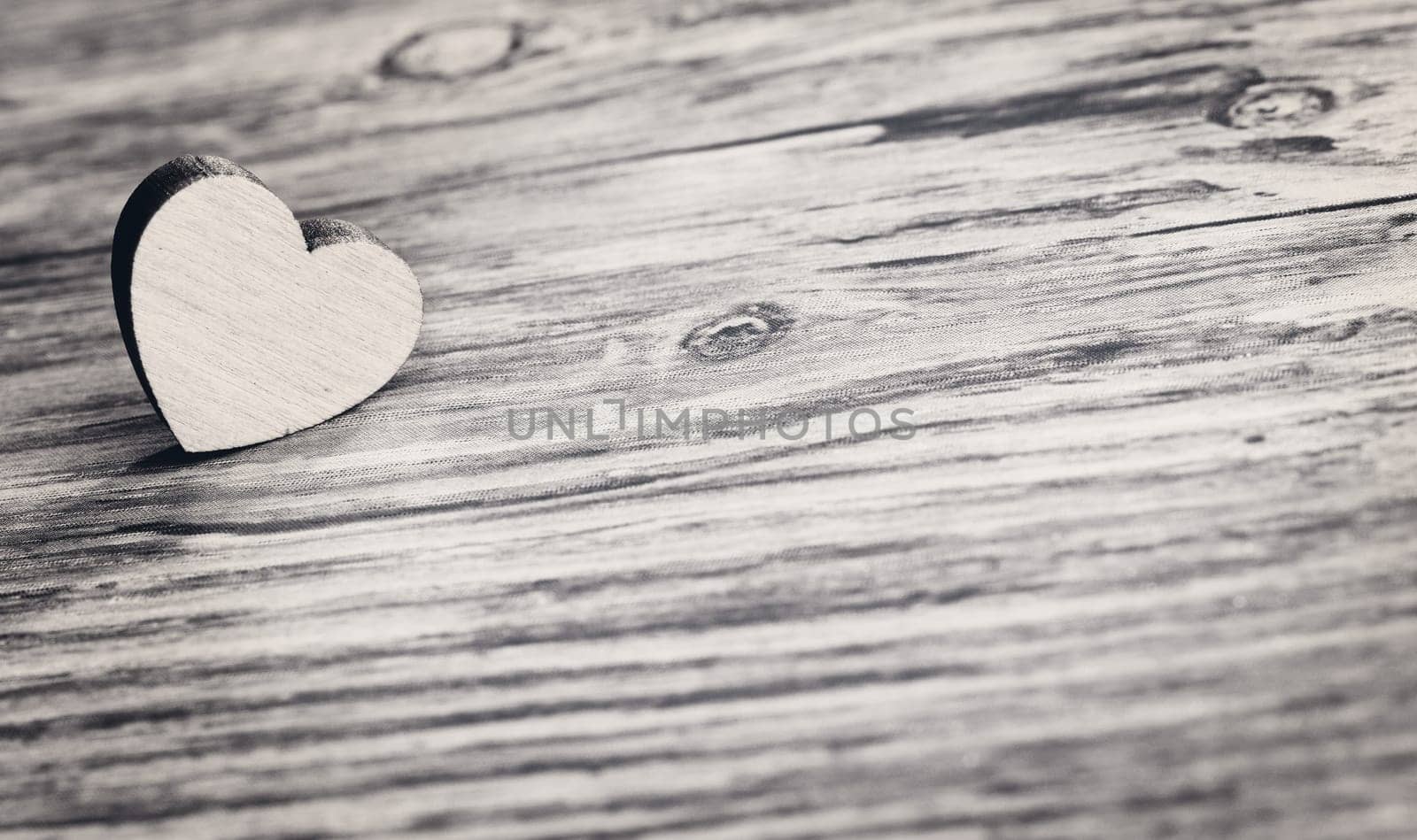 small heart on wooden board