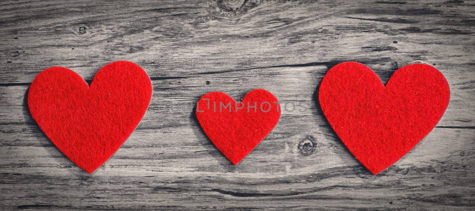 red hearts on a wooden surface