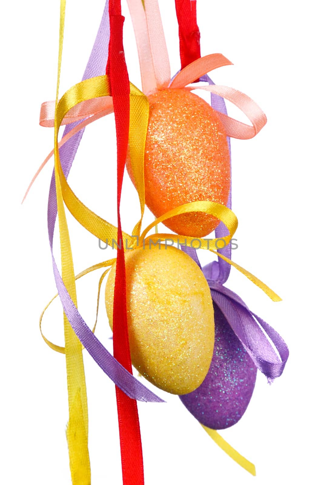 Easter eggs with ribbons on white background
