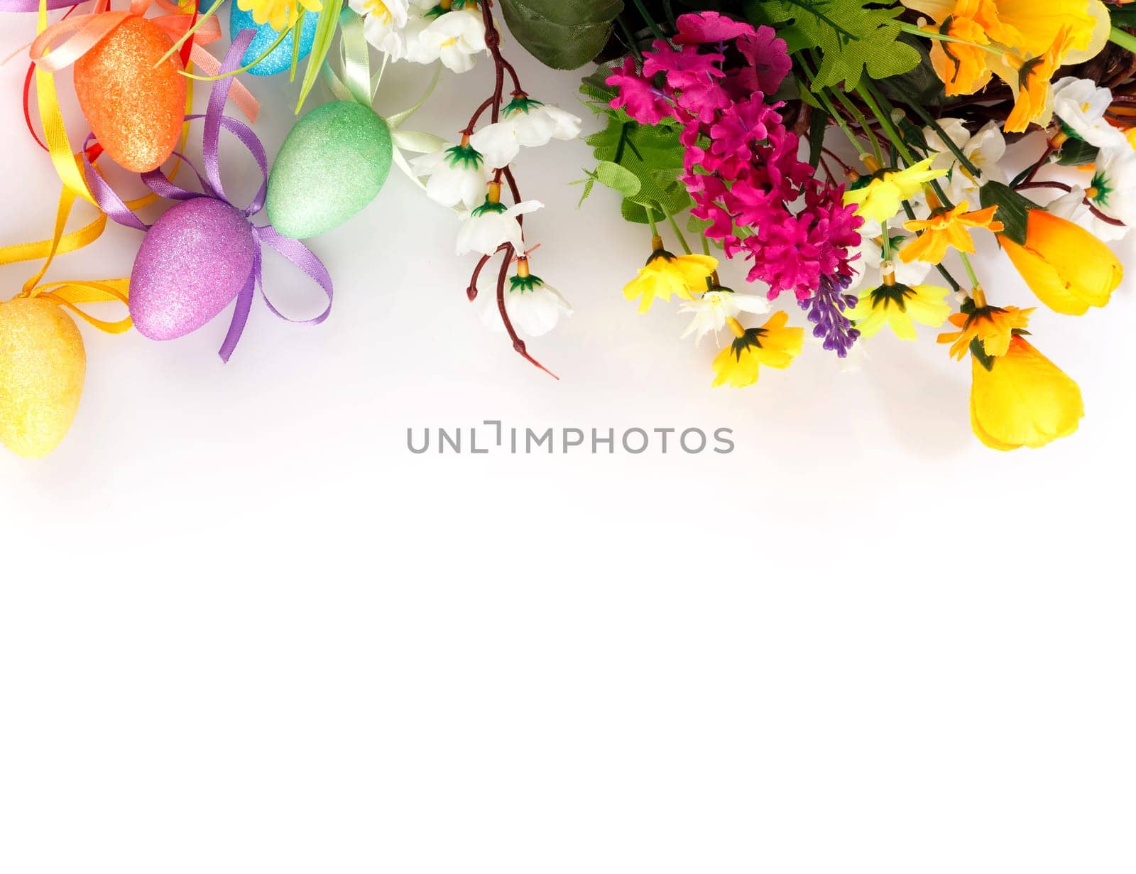colored easter eggs with flowers on a white background with space for text