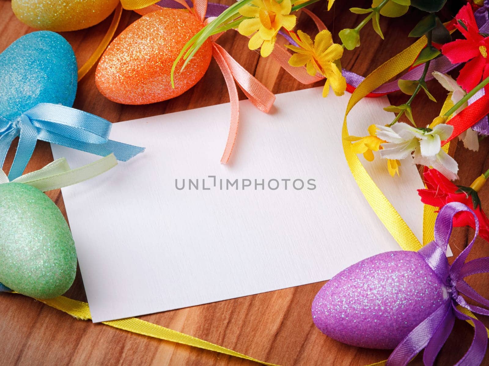 Easter greeting card with flowers and colorful eggs