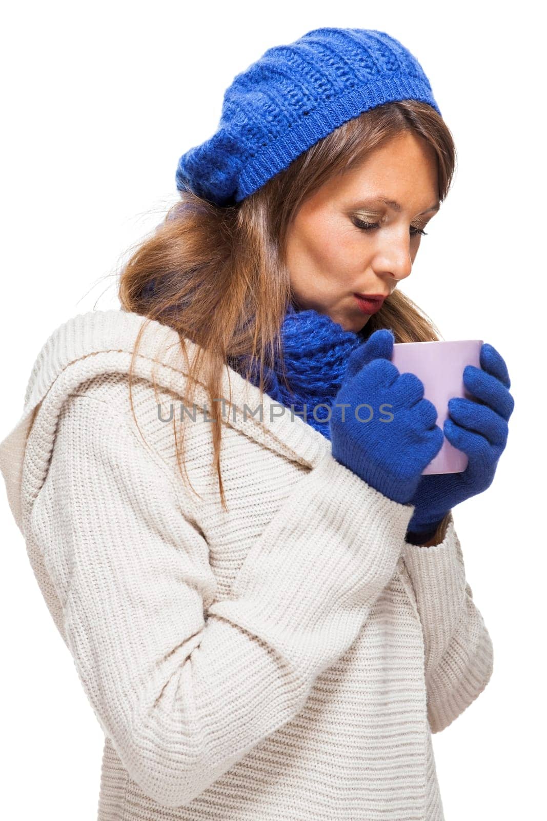 attractive pretty young woman with blue wool hat with long dark hair in winter isolated on white background