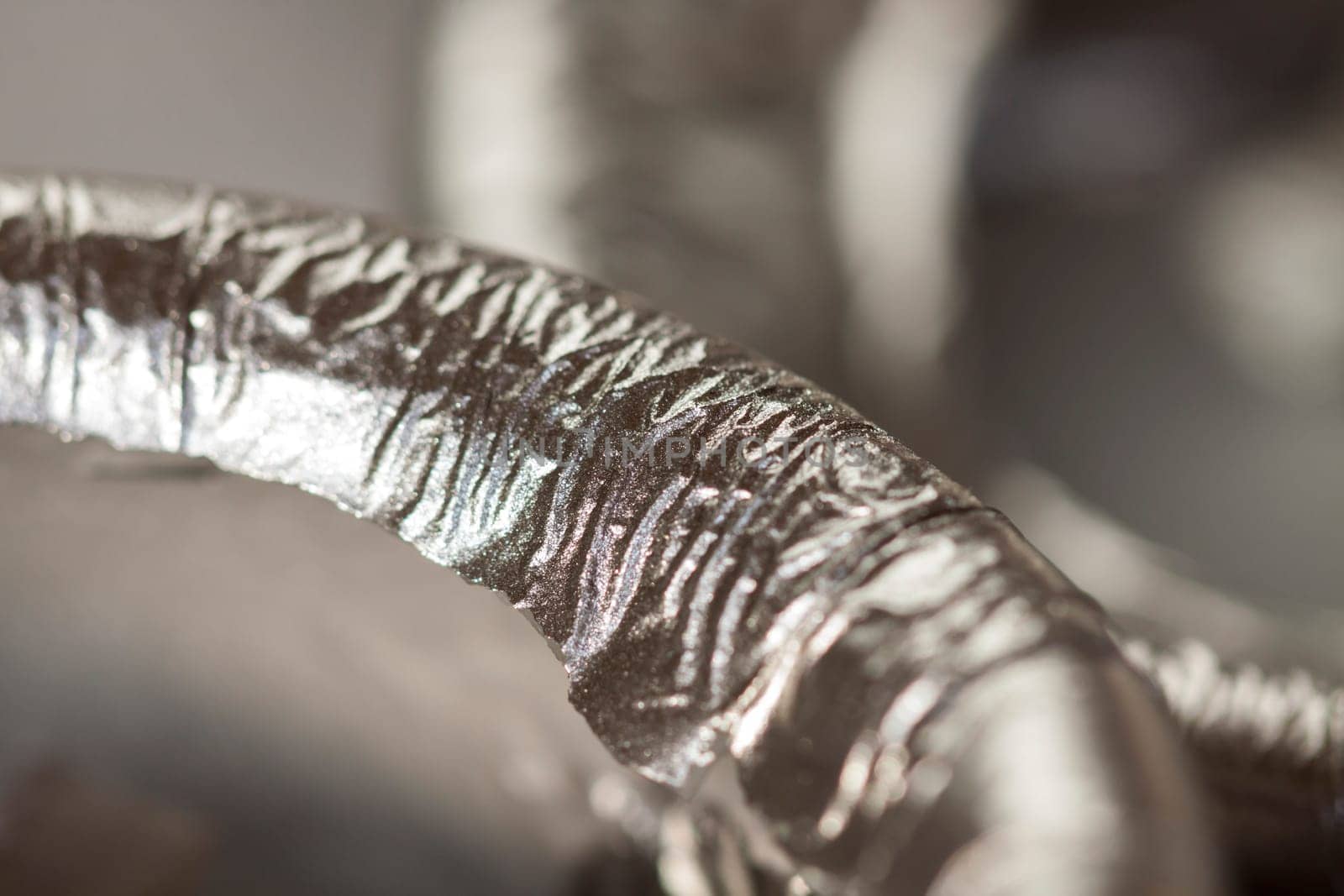 Extinguished wick of a silver candle as close-up detail