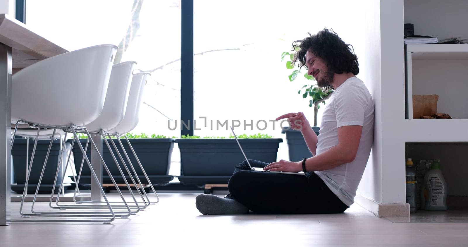 Real man Using laptop on the floor At Home  Enjoying Relaxing
