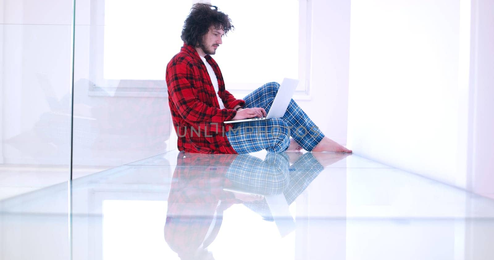 Real man Using laptop on the floor At Home  Enjoying Relaxing