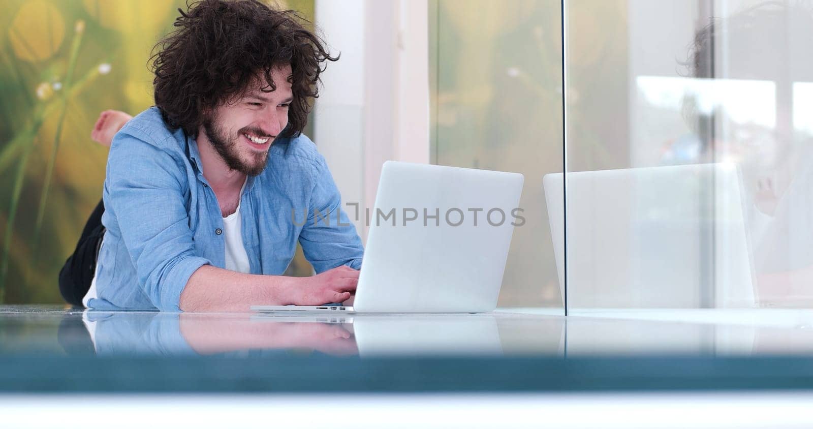 Real man Using laptop on the floor At Home  Enjoying Relaxing
