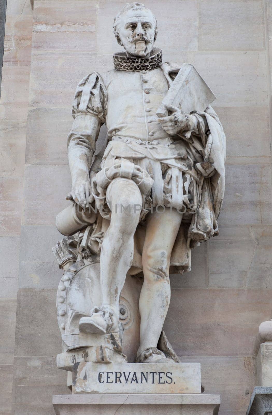 Spain, Madrid - March 6th, 2021: Miguel de Cervantes Saavedra statue. National Library of Spain entrance, Madrid. Sculpted by Joan Vancell Puigcercos in 1892