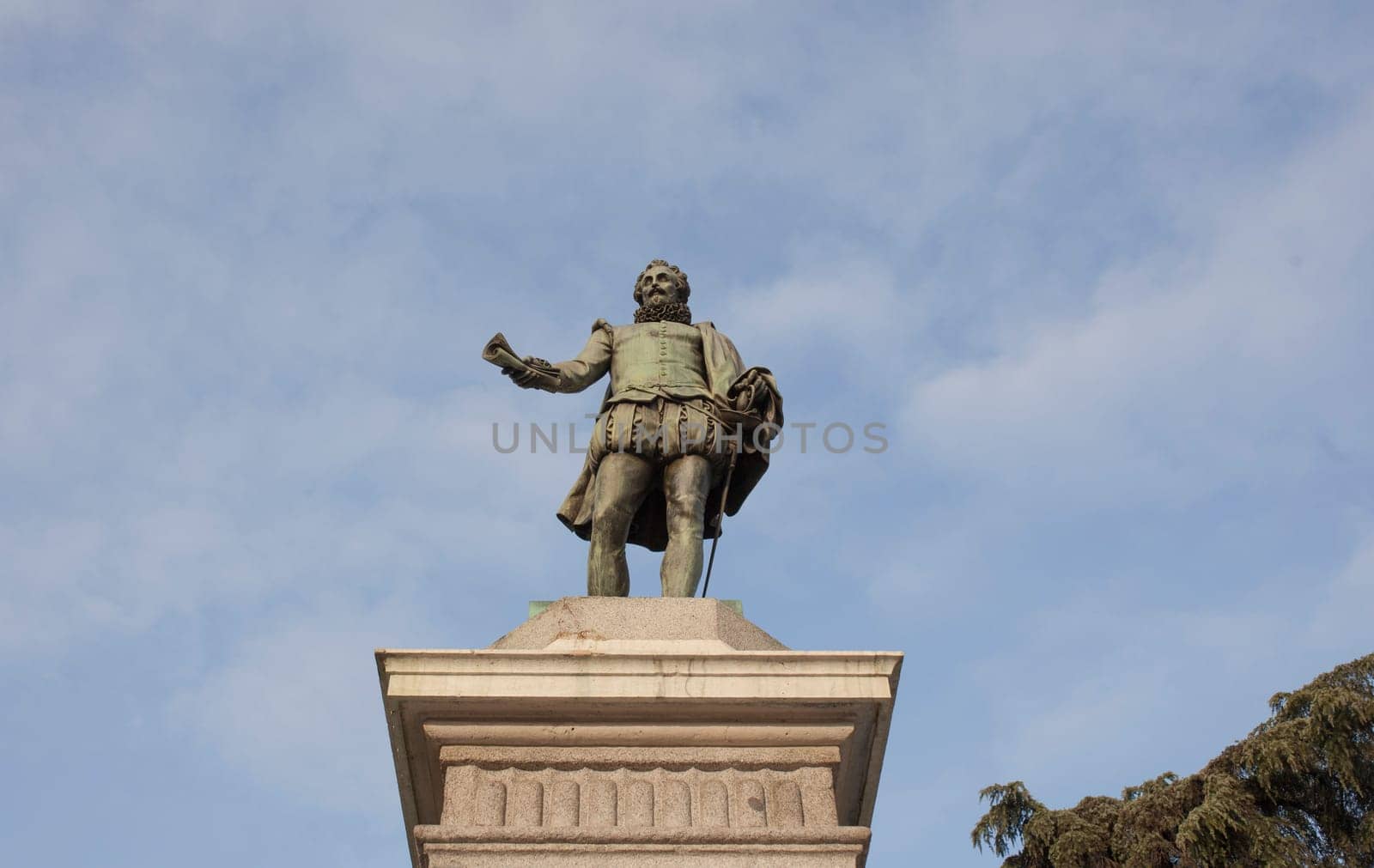 Spain, Madrid - March 6th, 2021: Miguel de Cervantes Saavedra statue. Erected in front of the Spanish Congress of Deputies, Madrid. By Antonio Sola in 1835