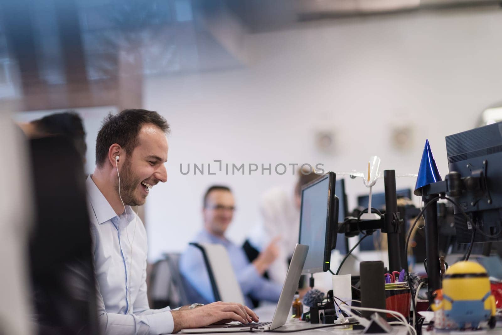 Young Entrepreneur Freelancer Working Using A Laptop In Coworking space